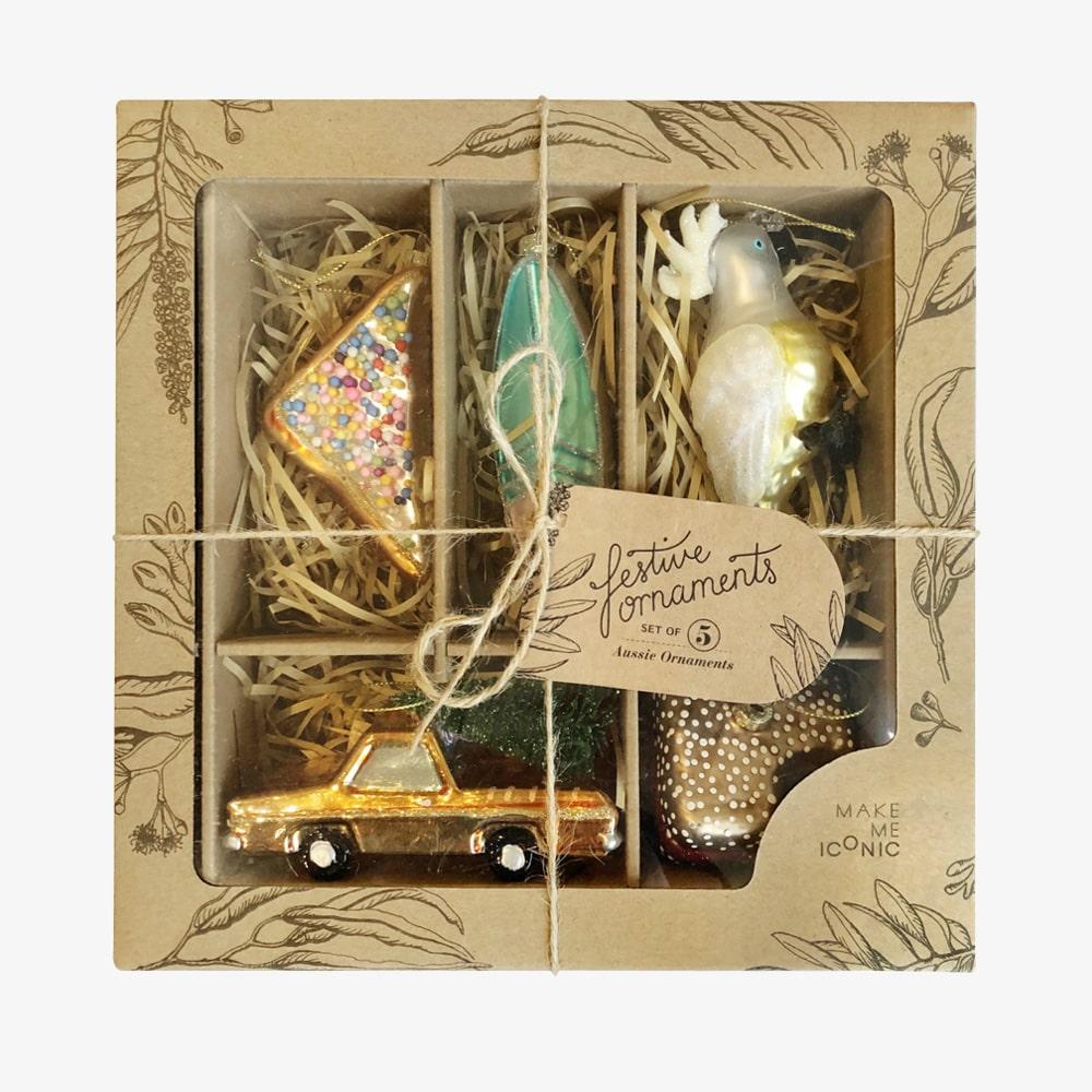 Make Me Iconic Christmas glass ornament set, 5-piece Australian-themed decorations featuring Fairy Bread, Lamington, Ute with tree, Surfboard, and Cockatoo, crafted in glass with paint and glitter details, great for gifts and Aussie souvenirs.