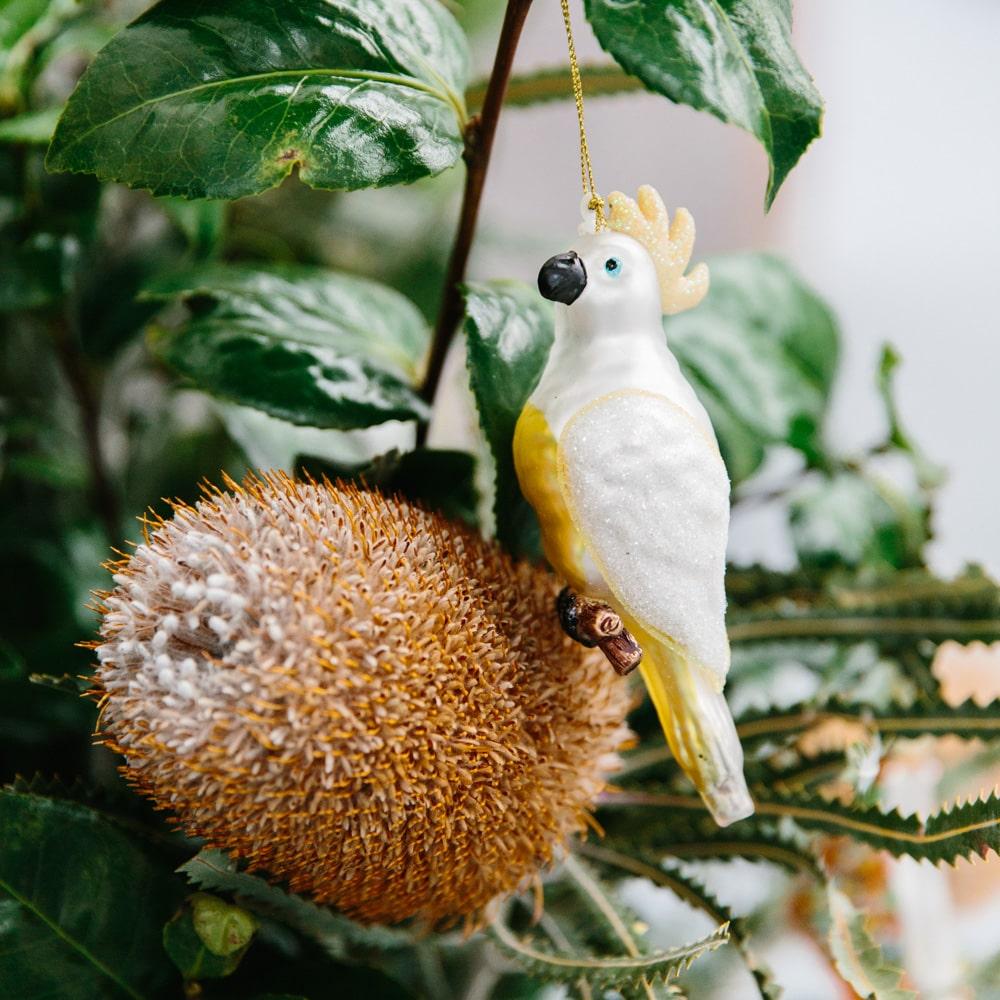 Make Me Iconic Christmas glass ornament set, 5-piece Australian-themed decorations featuring Fairy Bread, Lamington, Ute with tree, Surfboard, and Cockatoo, crafted in glass with paint and glitter details, great for gifts and Aussie souvenirs.