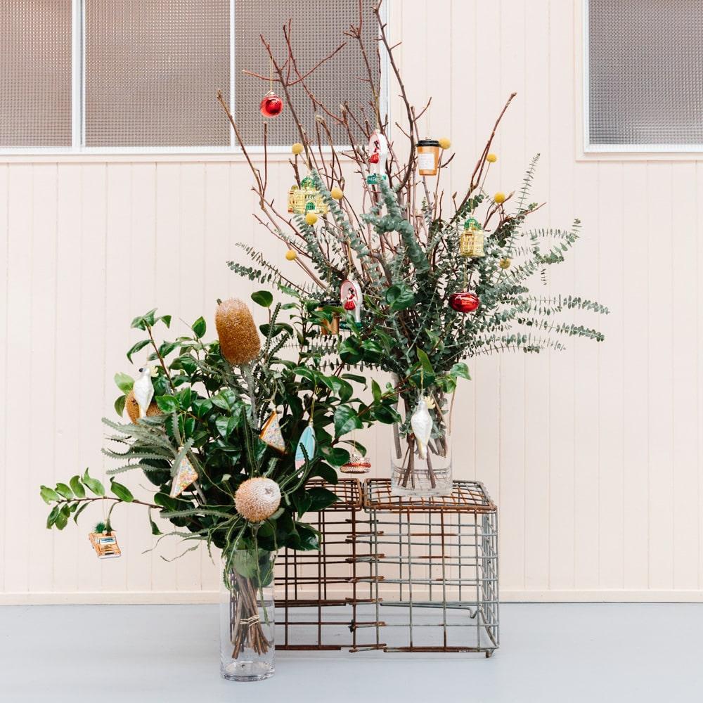 Melbourne Christmas glass ornaments in a gift box featuring Australian holiday decorations such as the Skipping Girl, W-Class Tram, Flinders Street Station, and Coffee Snob designs.