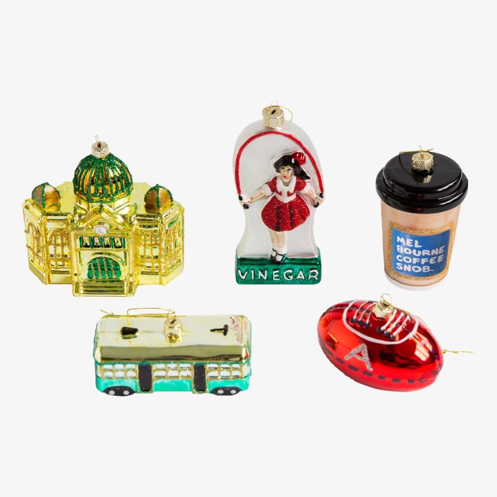 Melbourne Christmas glass ornaments in a gift box featuring Australian holiday decorations such as the Skipping Girl, W-Class Tram, Flinders Street Station, and Coffee Snob designs.