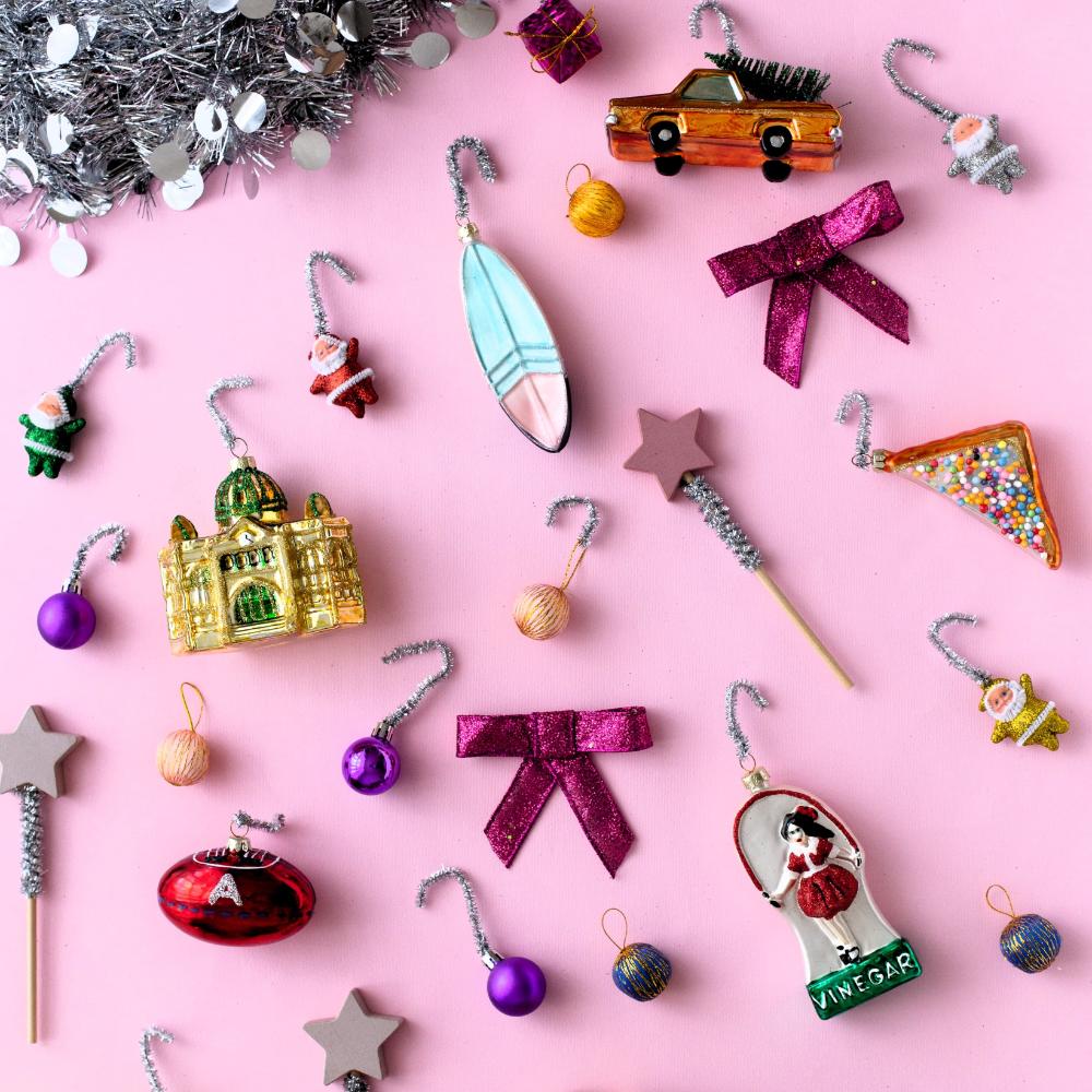 Melbourne Christmas glass ornaments in a gift box featuring Australian holiday decorations such as the Skipping Girl, W-Class Tram, Flinders Street Station, and Coffee Snob designs.