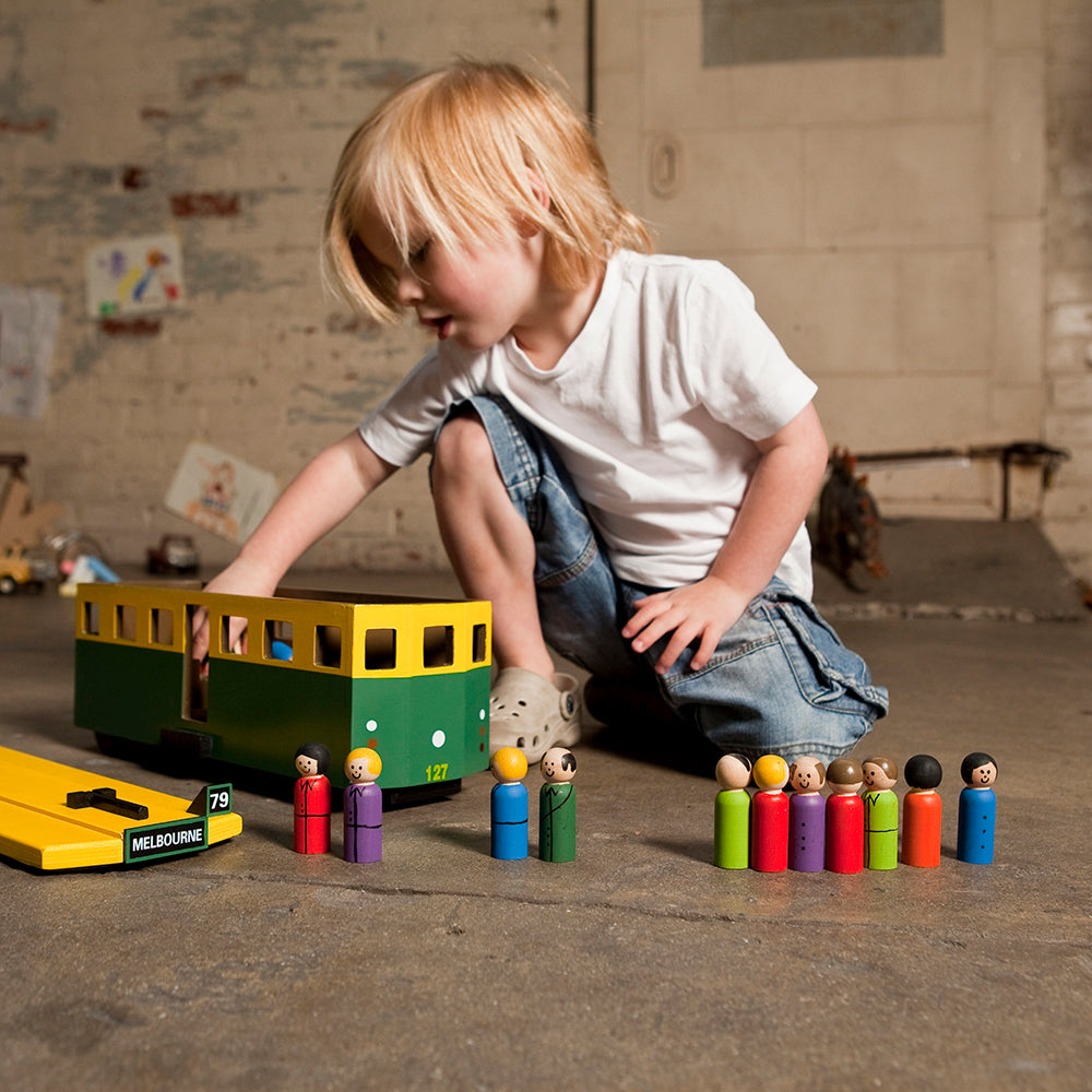 Make Me Iconic 16-piece wooden toy tram set with tram, 12 passengers, and 2 conductors is great for pretend play and building hand-eye coordination.