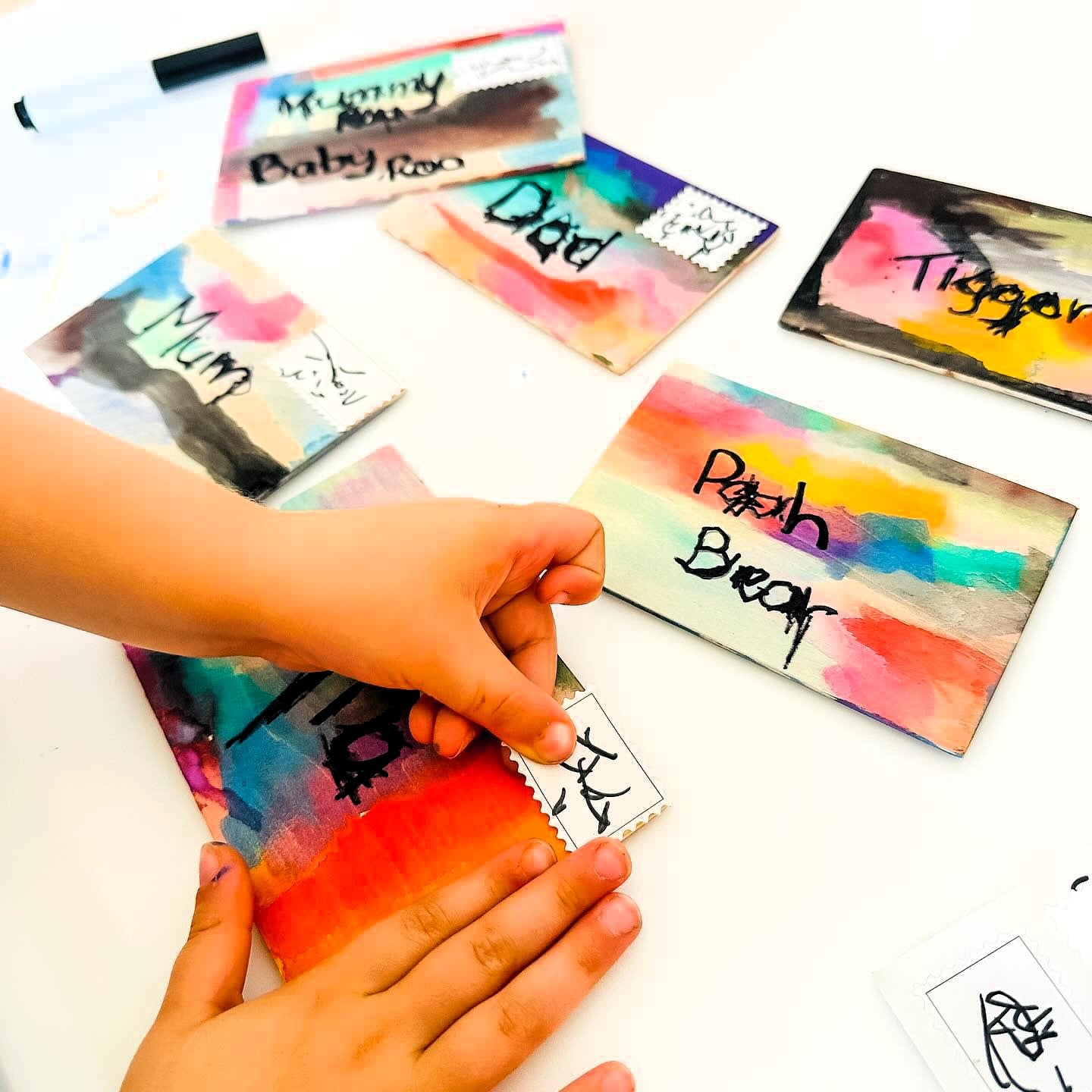 DIY Post Box Letters Craft Kit with colourful paper letters, stamps, and envelopes designed to pair with wooden toy Iconic Post Box for imaginative play.