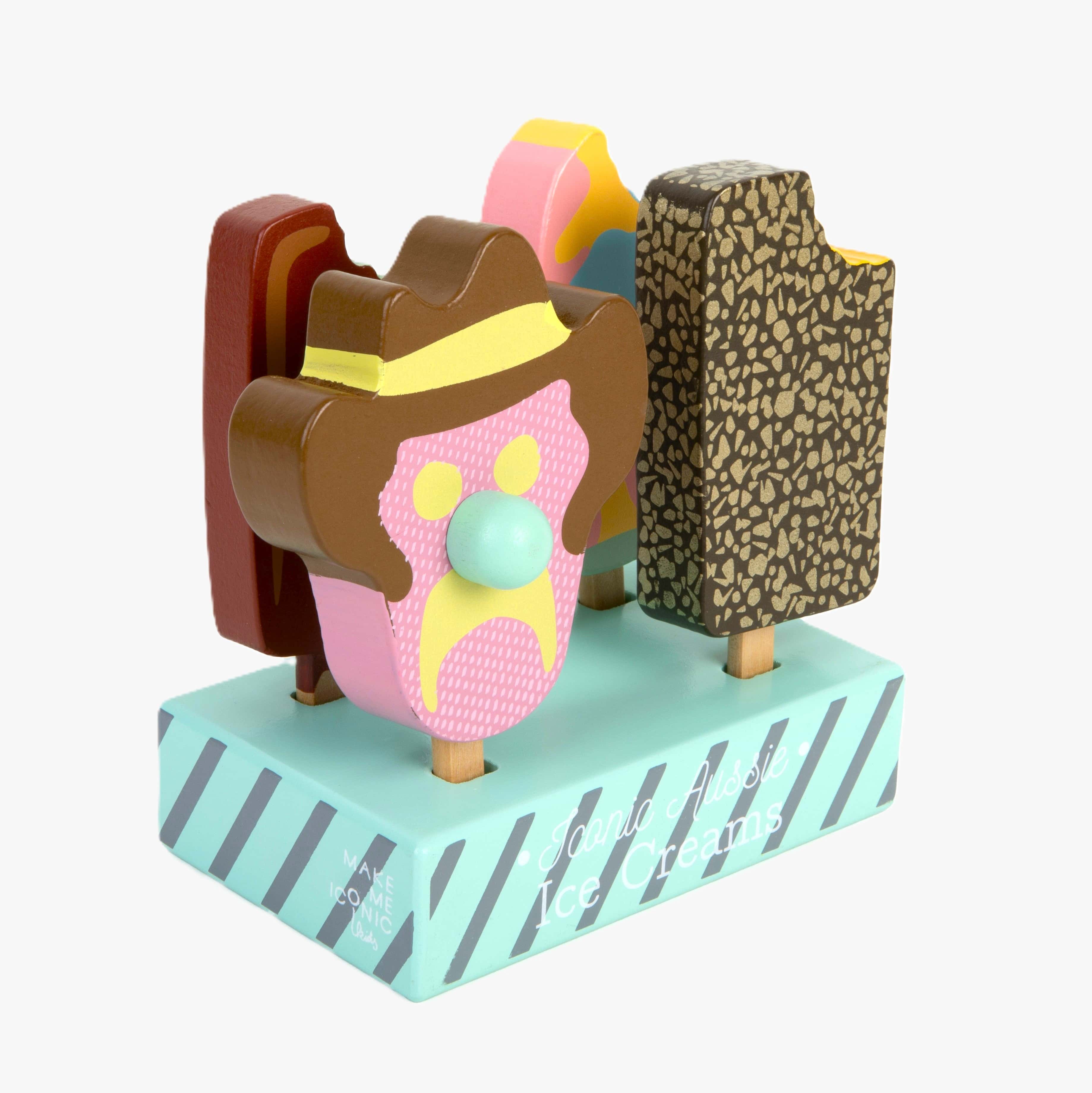 Wooden toy ice cream set with Bubble O’ Bill, Golden Gaytime, Mint Choc Wedge, Rainbow Paddle Pop, wooden stand and paper bags for pretend play.