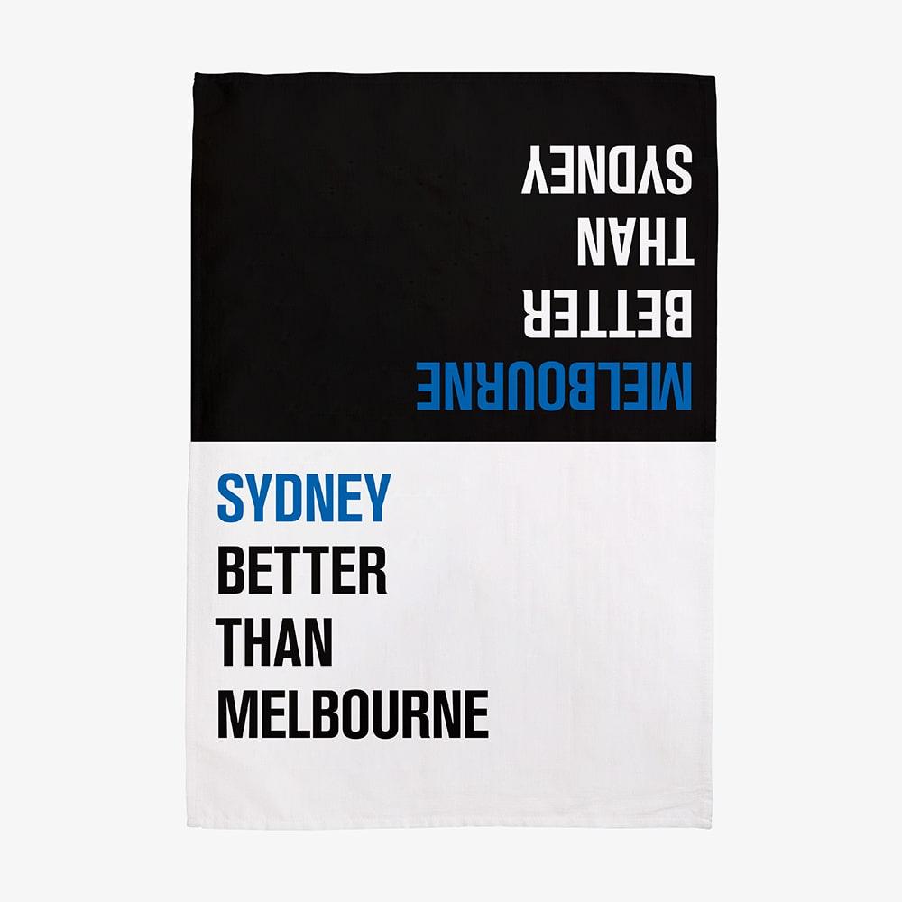 Make Me Iconic Choice Tea Towel with bold double-sided print, Melbourne vs Sydney rivalry in playful, nostalgic kitchen style.