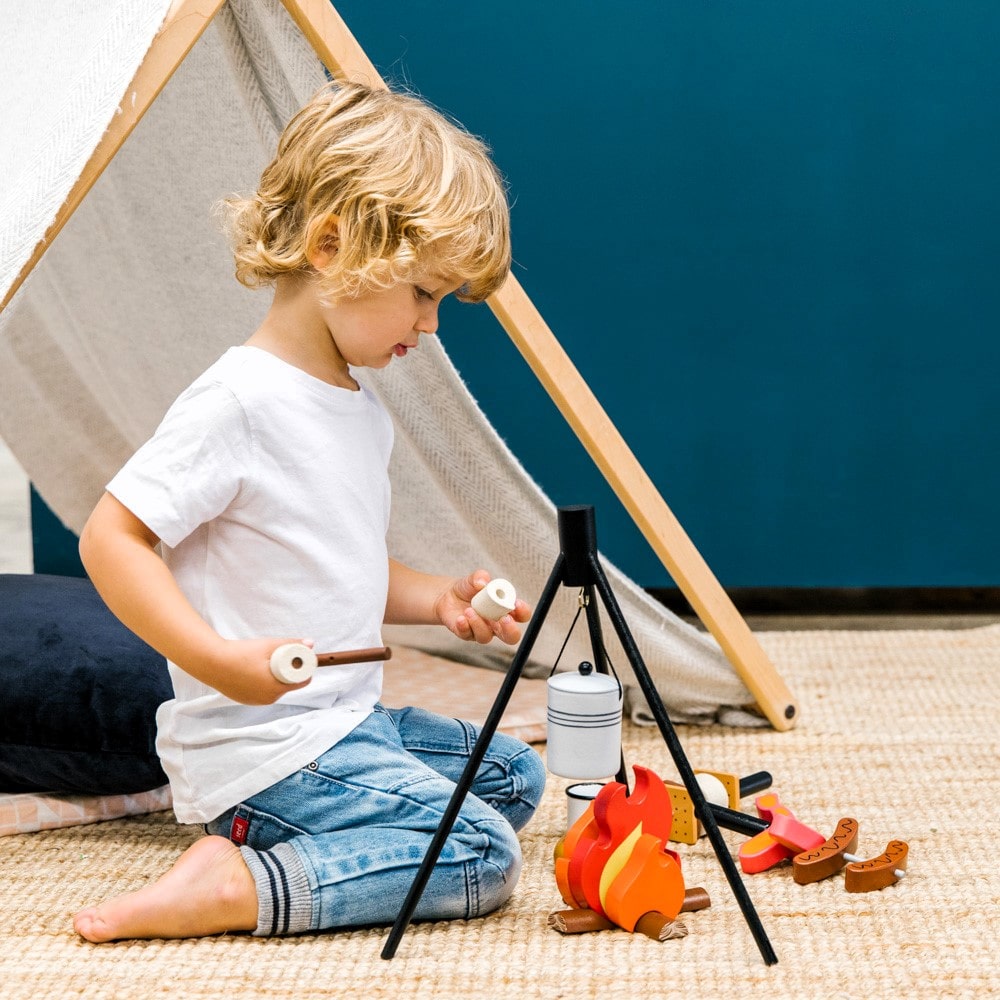 Wooden Camp Fire toy set for kids with tripod, billy can, sausages, prawns, logs, and marshmallows designed for imaginative indoor camping and pretend play