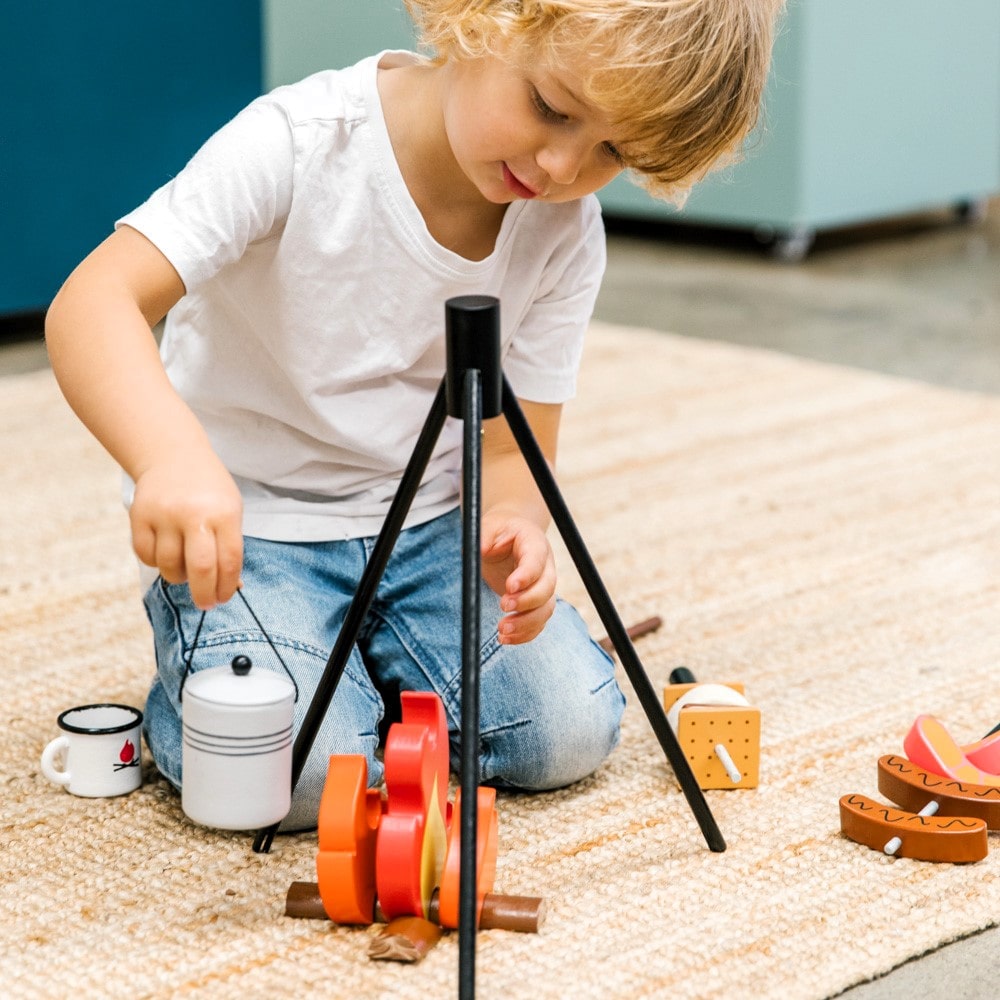 Wooden Camp Fire toy set for kids with tripod, billy can, sausages, prawns, logs, and marshmallows designed for imaginative indoor camping and pretend play