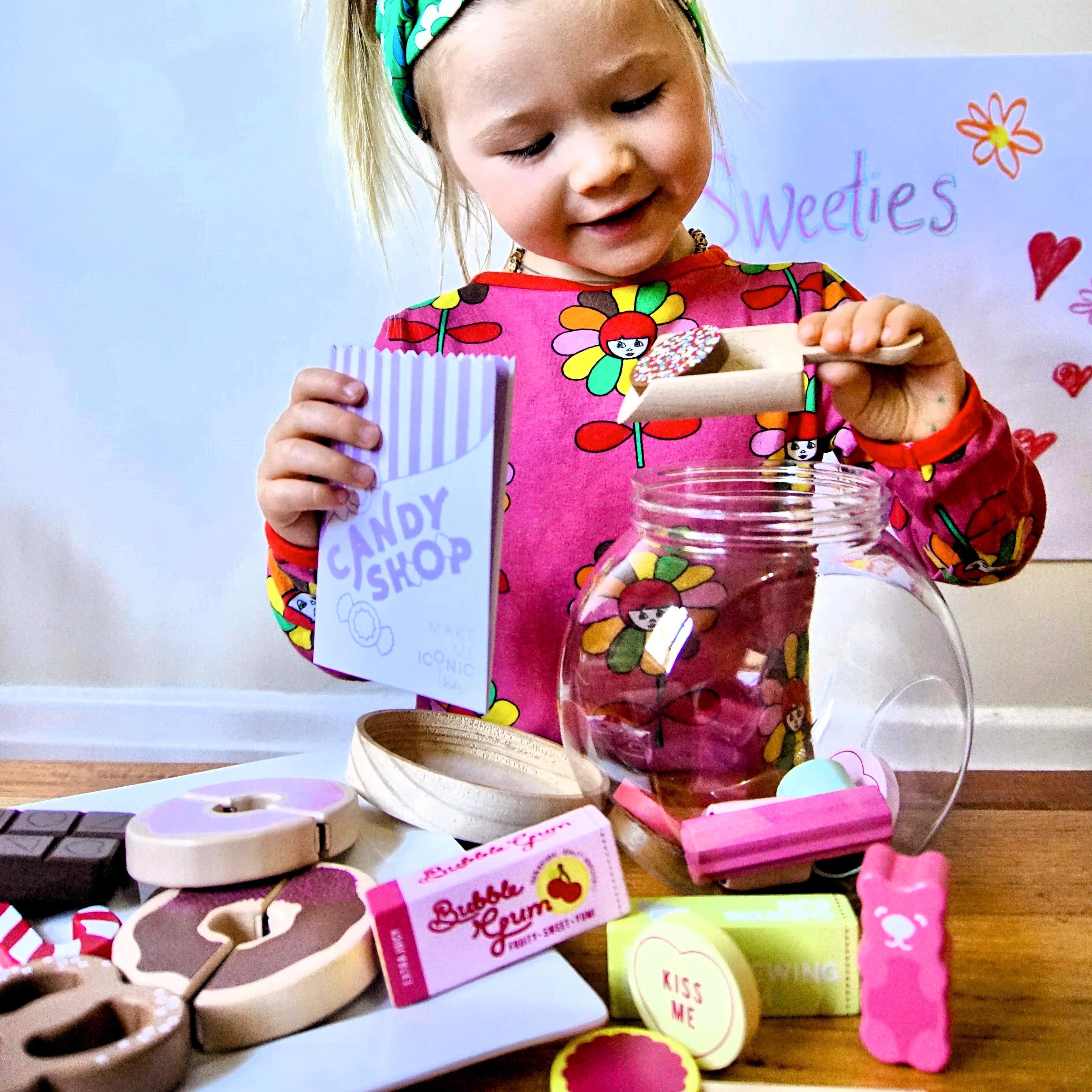 Wooden candy jar toy set for kids featuring hand-painted lollies, candy canes and wrapped sweets in an acrylic jar designed for imaginative pretend play.