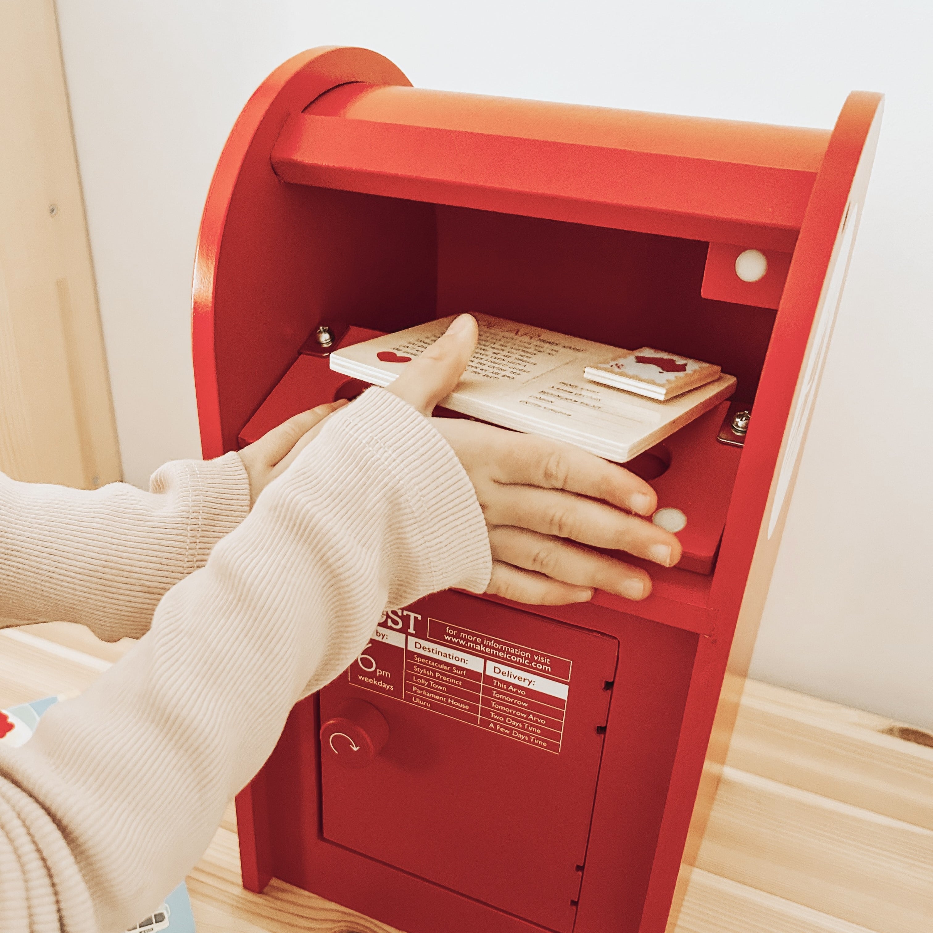 Wooden Australian post box toy with working mail slot, 6 wooden letters, and 6 Velcro stamps perfect for imaginative pretend play and storytelling.