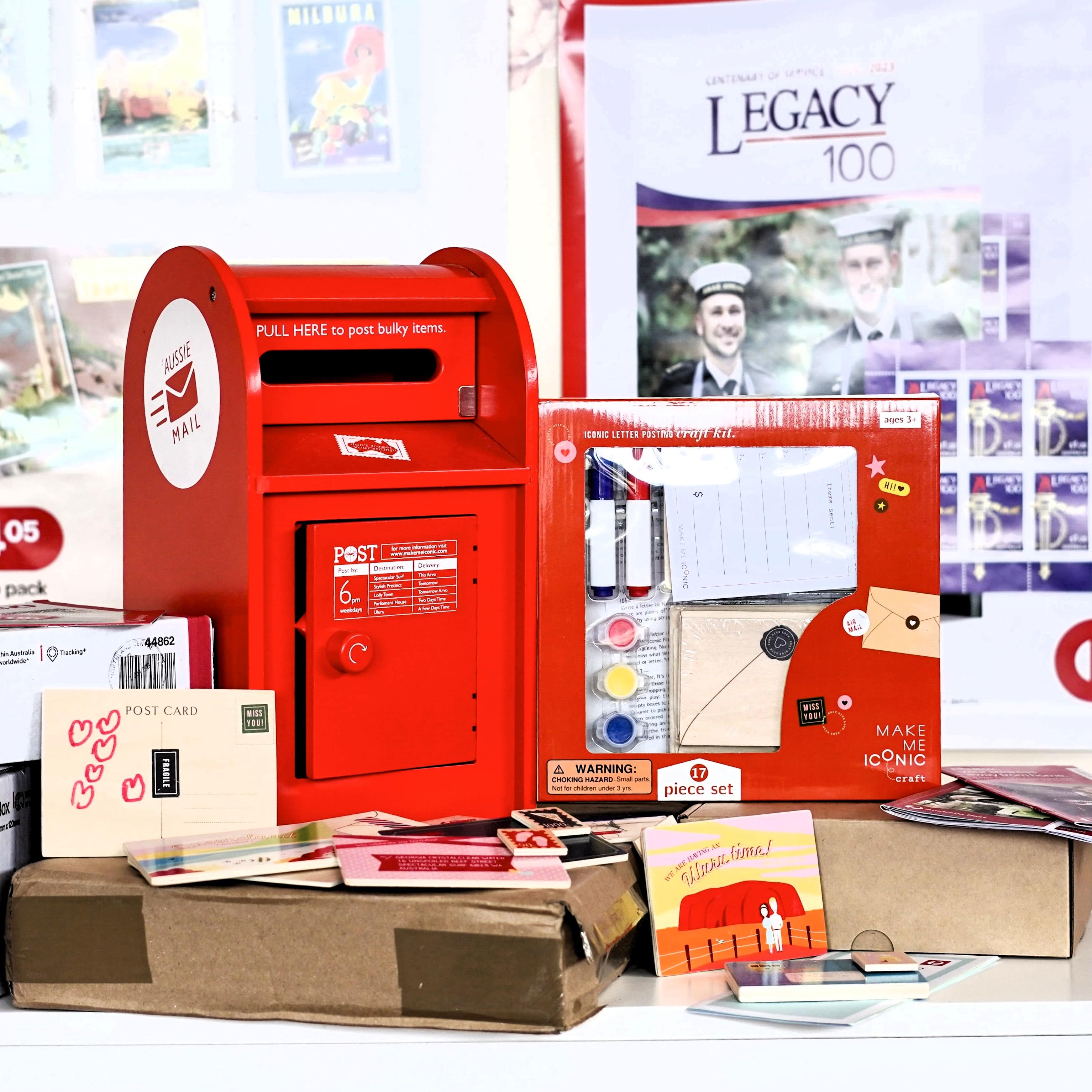 Wooden Australian post box toy with working mail slot, 6 wooden letters, and 6 Velcro stamps perfect for imaginative pretend play and storytelling.