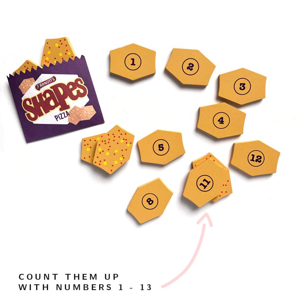 Make Me Iconic Arnott’s Shapes Australian wooden toy set – pretend play food with Barbecue, Pizza, and Chicken Crimpy biscuits, matching games, counting activities, and mini paper snack bags.