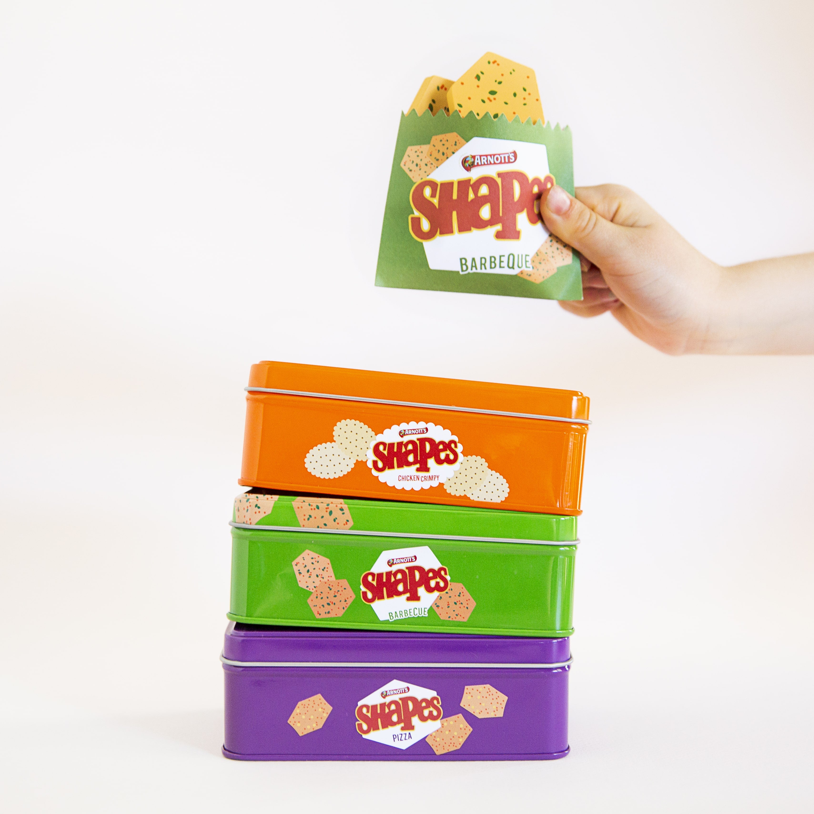 Australian Arnott’s Shapes set wooden toy with Barbecue, Pizza, and Chicken Crimpy biscuits, matching games, counting activities, and mini paper bags for pretend play.