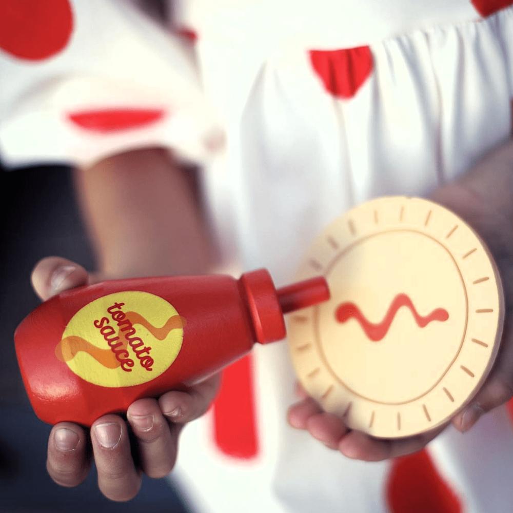 Make Me Iconic Australian wooden toy food set, 38-piece pretend play set featuring Vegemite, Fairy Bread, Pavlova, Lamington, meat pie, snag in bread, and hot Chips with sauce for imaginative kitchen play.