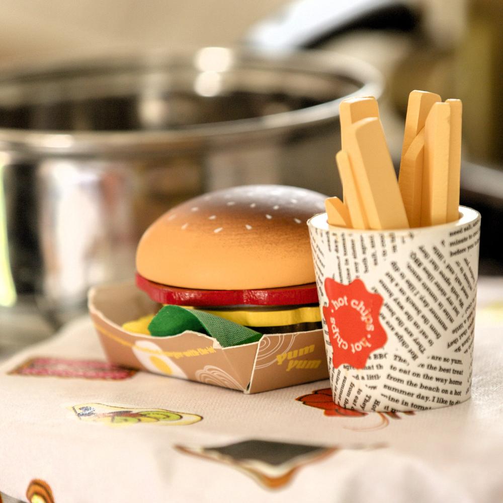 Make Me Iconic Australian wooden toy food set, 38-piece pretend play set featuring Vegemite, Fairy Bread, Pavlova, Lamington, meat pie, snag in bread, and hot Chips with sauce for imaginative kitchen play.