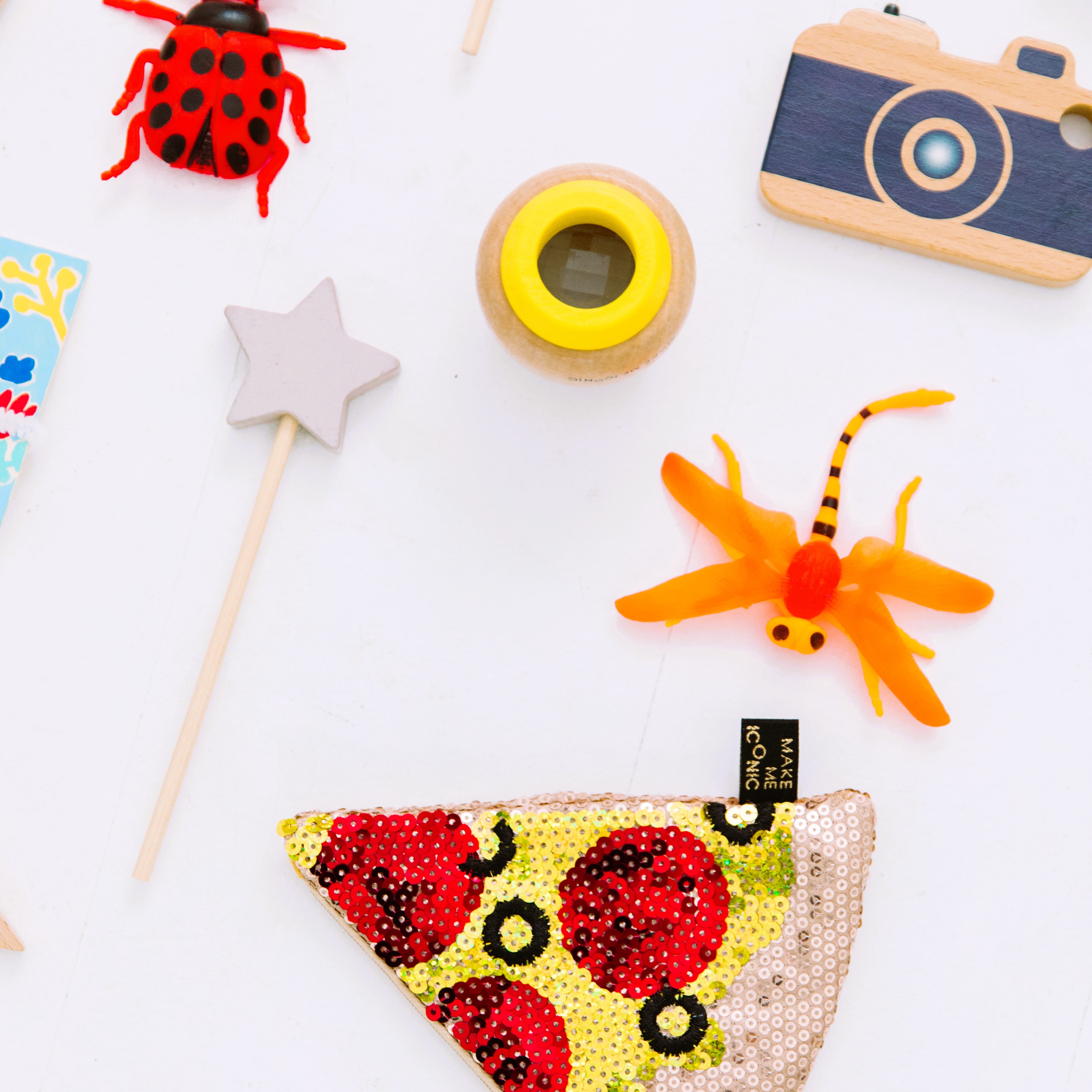 Wooden toy camera for kids with real viewfinder and pressable button, designed for imaginative pretend play and creative role-play photography fun.