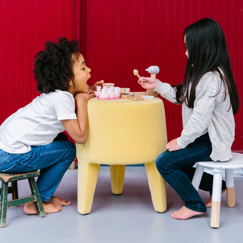 Wooden toy dentist kit with model mouth, removable teeth, dental tools, and carry box for imaginative pretend play