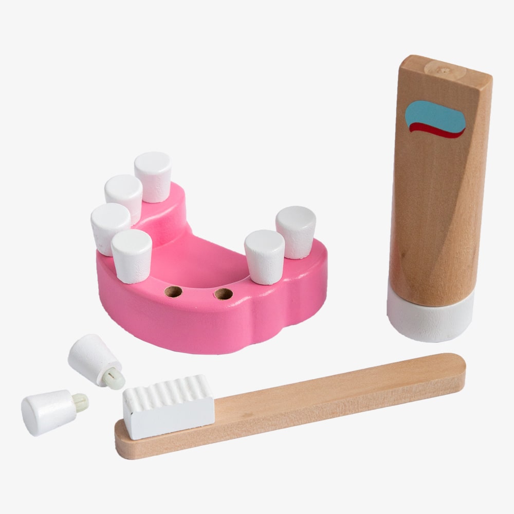 Wooden toy dentist kit with model mouth, removable teeth, dental tools, and carry box for imaginative pretend play