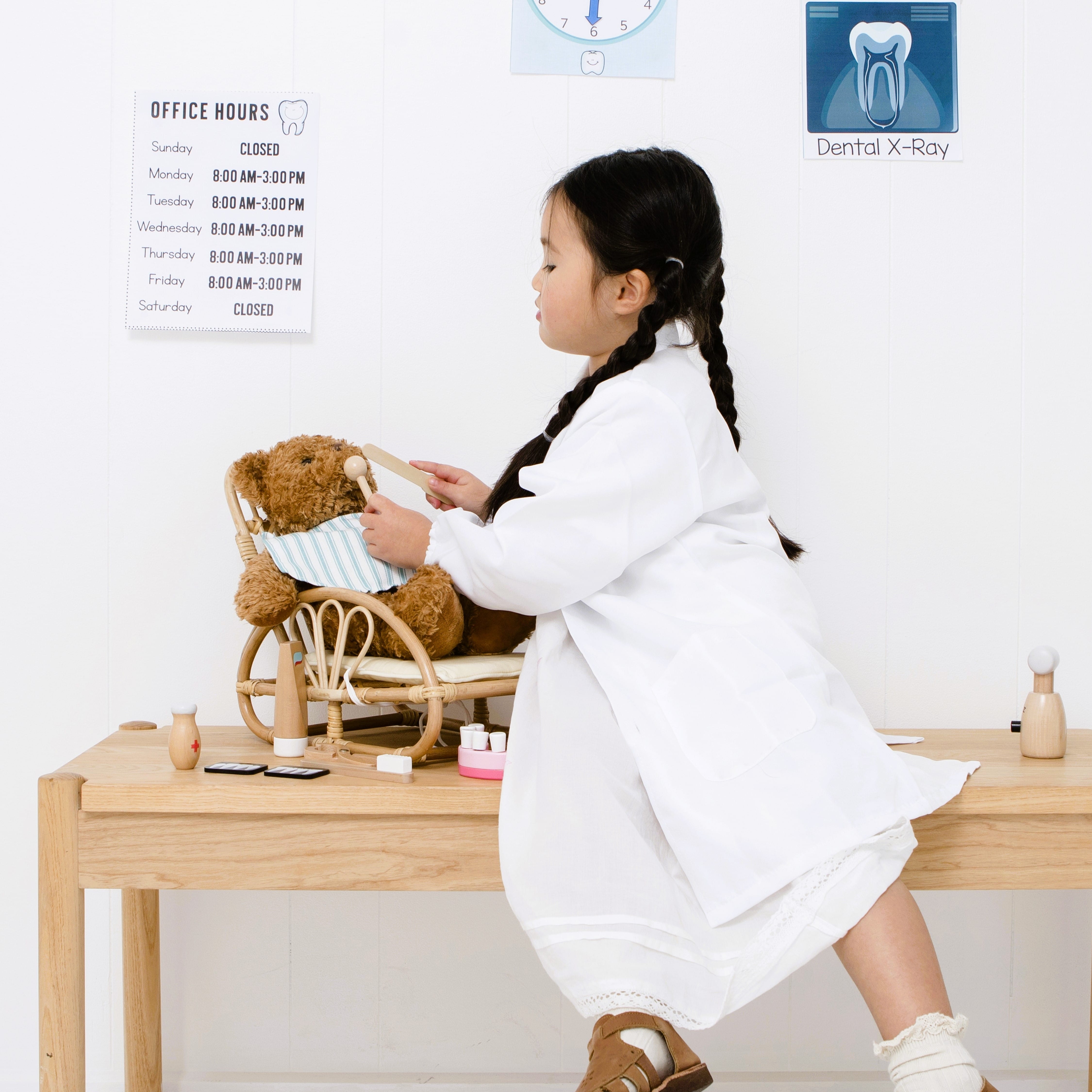 Wooden toy dentist kit with model mouth, removable teeth, dental tools, and carry box for imaginative pretend play