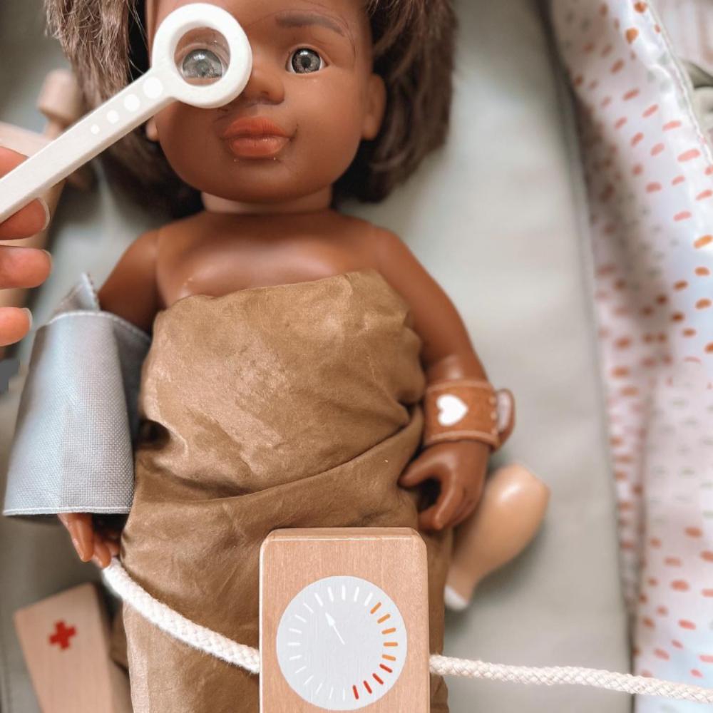 Make Me Iconic wooden Doctor’s Kit for kids, gender-neutral pretend play set with real wooden tools including stethoscope, syringe, and thermometer. Encourages imaginative play, empathy, and role-playing for young doctors and nurses.