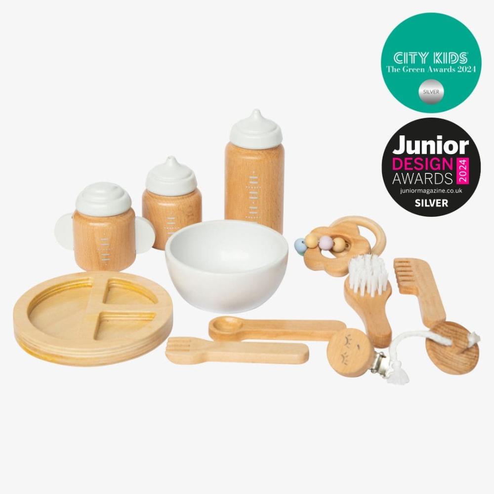 Make Me Iconic 11-piece wooden toy doll accessory kit with bottles, sippy cup, bowl, fork, spoon, brush with real bristles, comb, teether, and clip-on pacifier, perfect for pretend play.