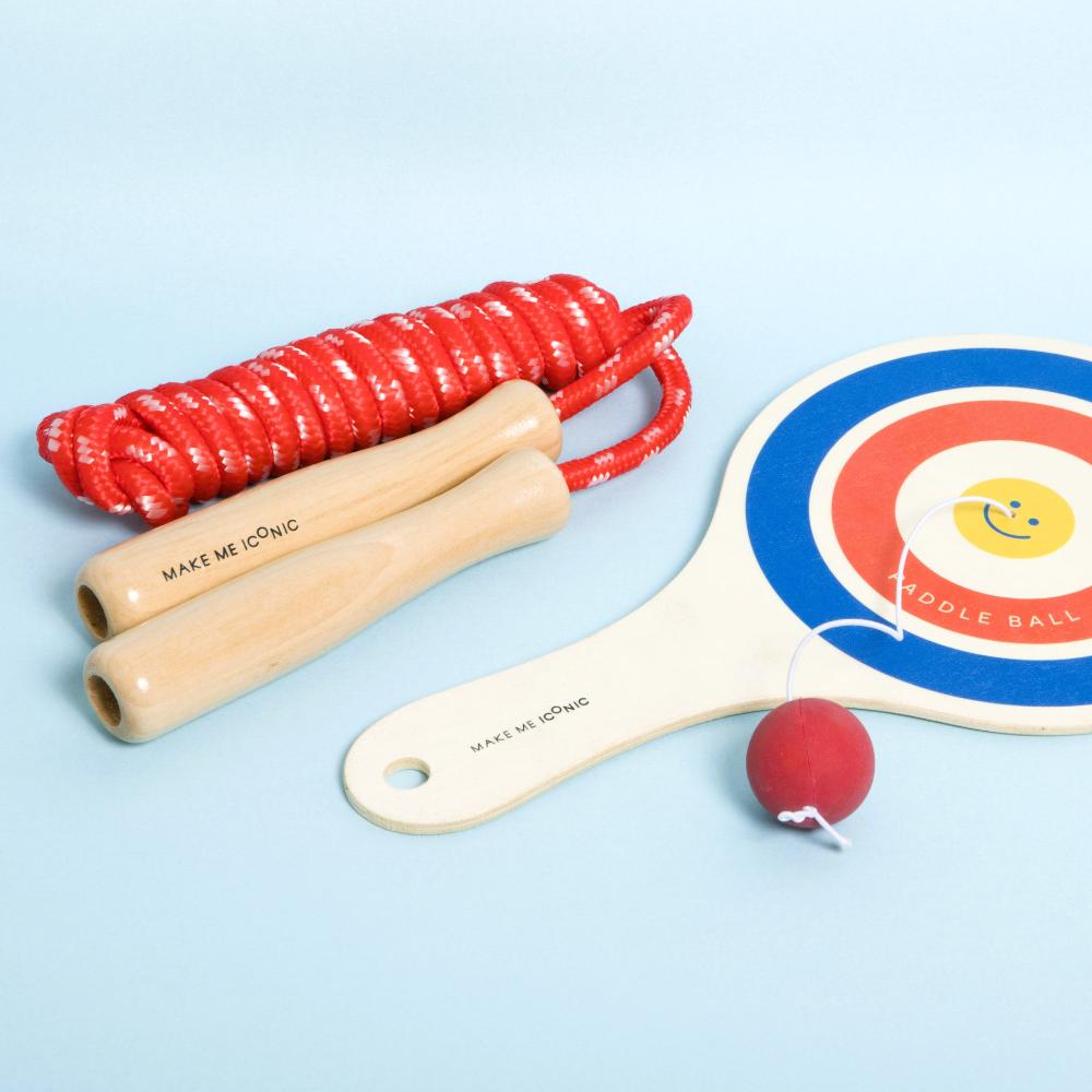 Make Me Iconic wooden skipping rope with smooth natural handles and red-coloured rope, designed for active play, coordination, and classic childhood fun.