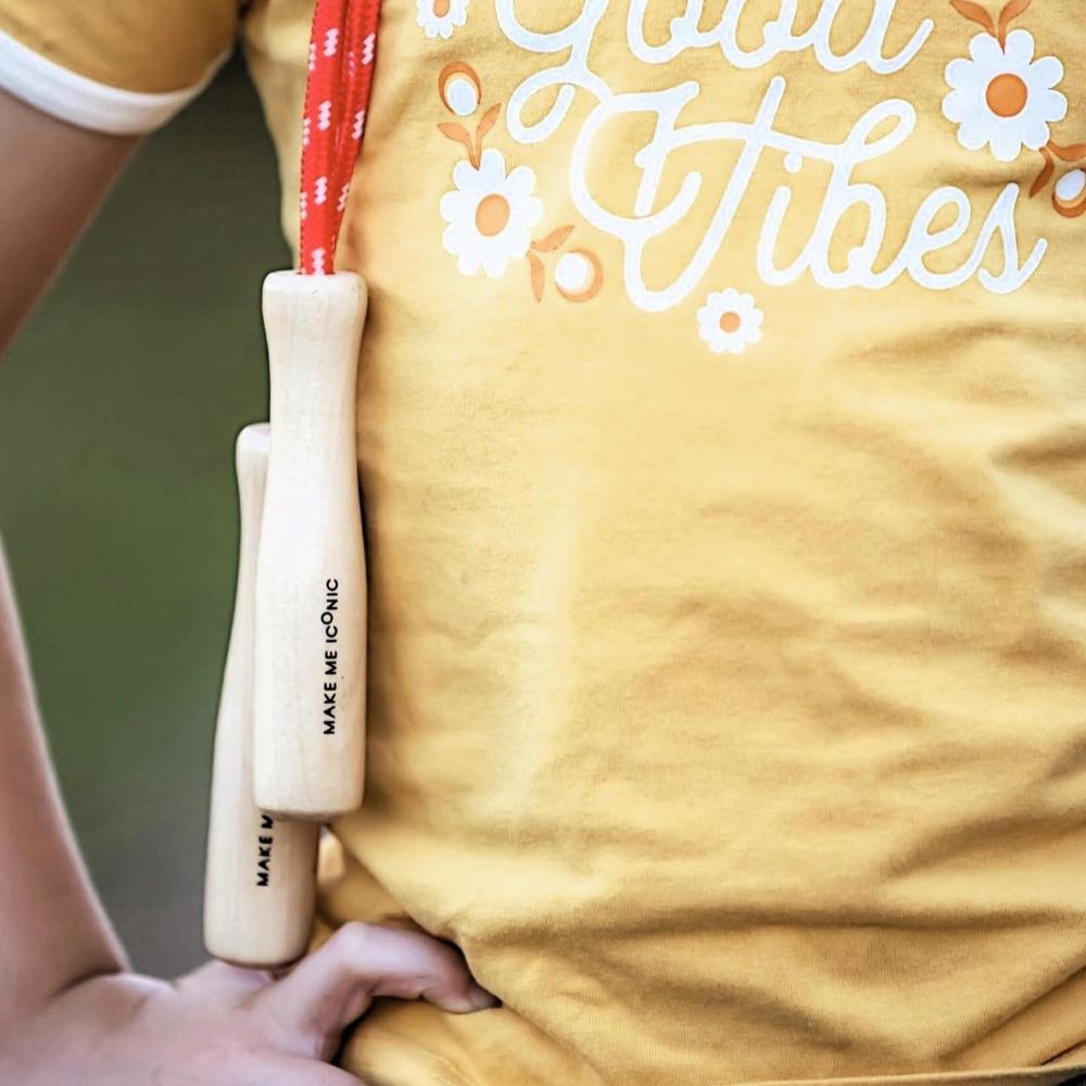 Make Me Iconic wooden skipping rope with smooth natural handles and red-coloured rope, designed for active play, coordination, and classic childhood fun.