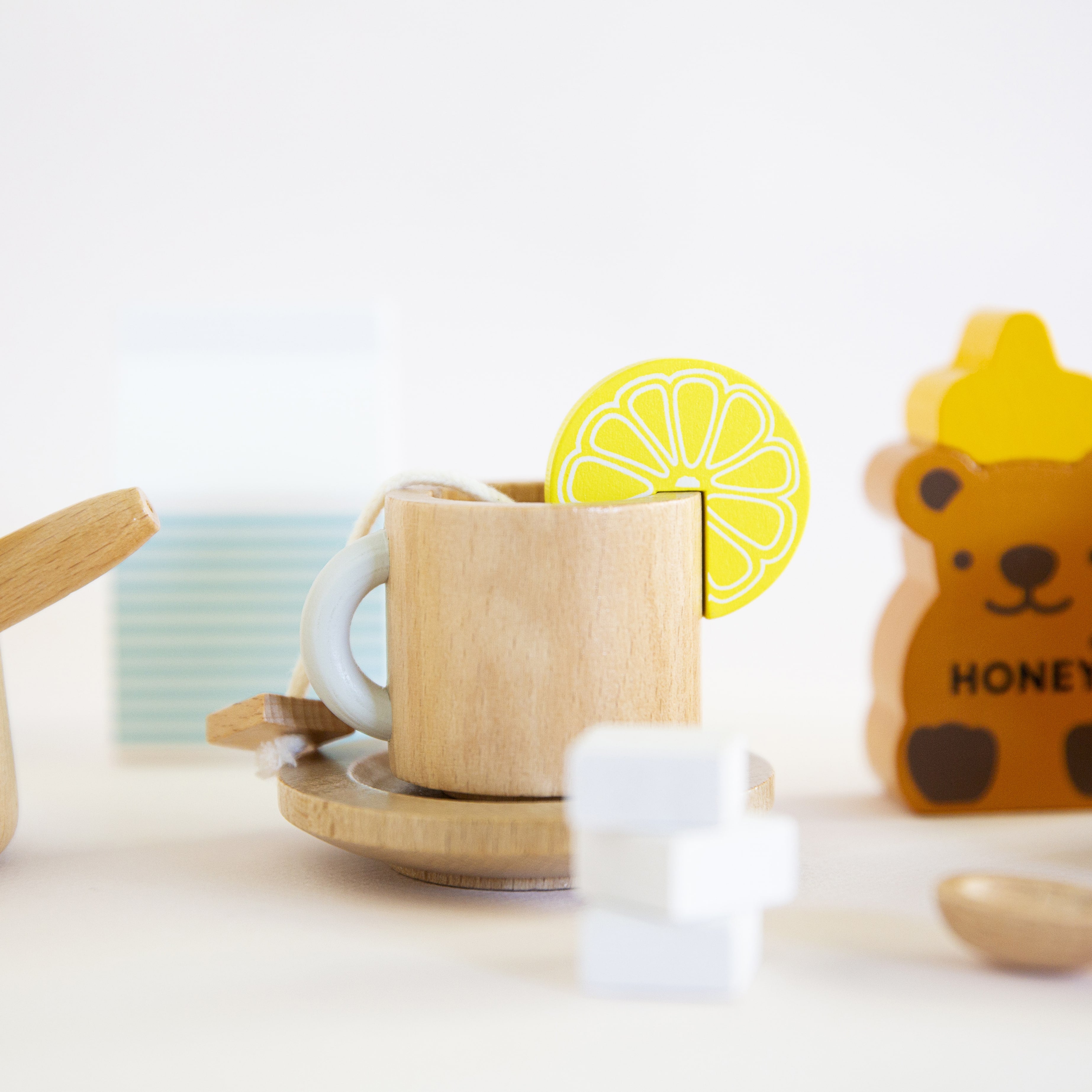 Make Me Iconic 27-piece wooden toy Tea Set Extension Set with tea cups, tea bags, tongs, cookies, and accessories. Ideal for pretend play and perfectly matched with our wooden toy Tea Set.