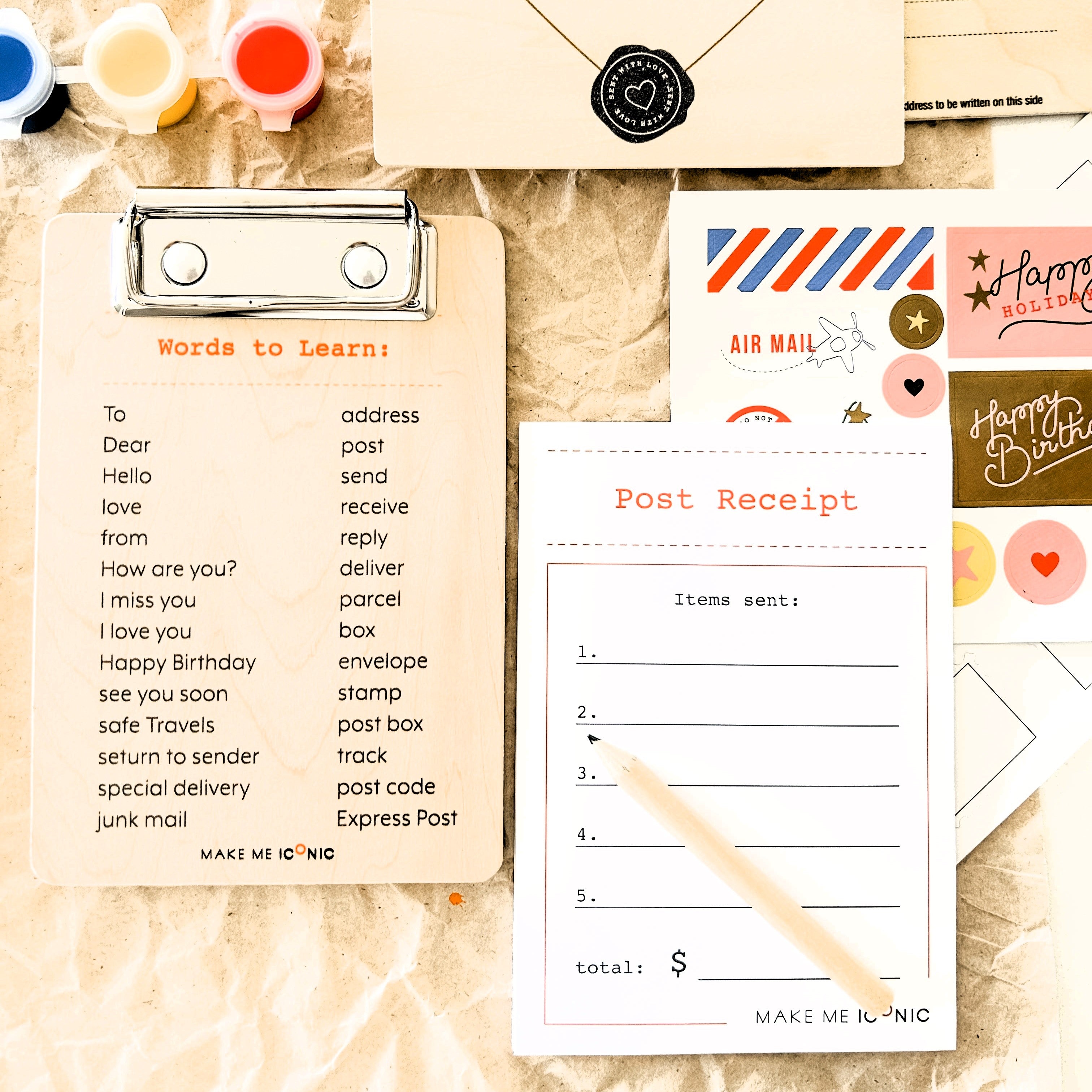 DIY Post Box Letters Craft Kit with colourful paper letters, stamps, and envelopes designed to pair with wooden toy Iconic Post Box for imaginative play.