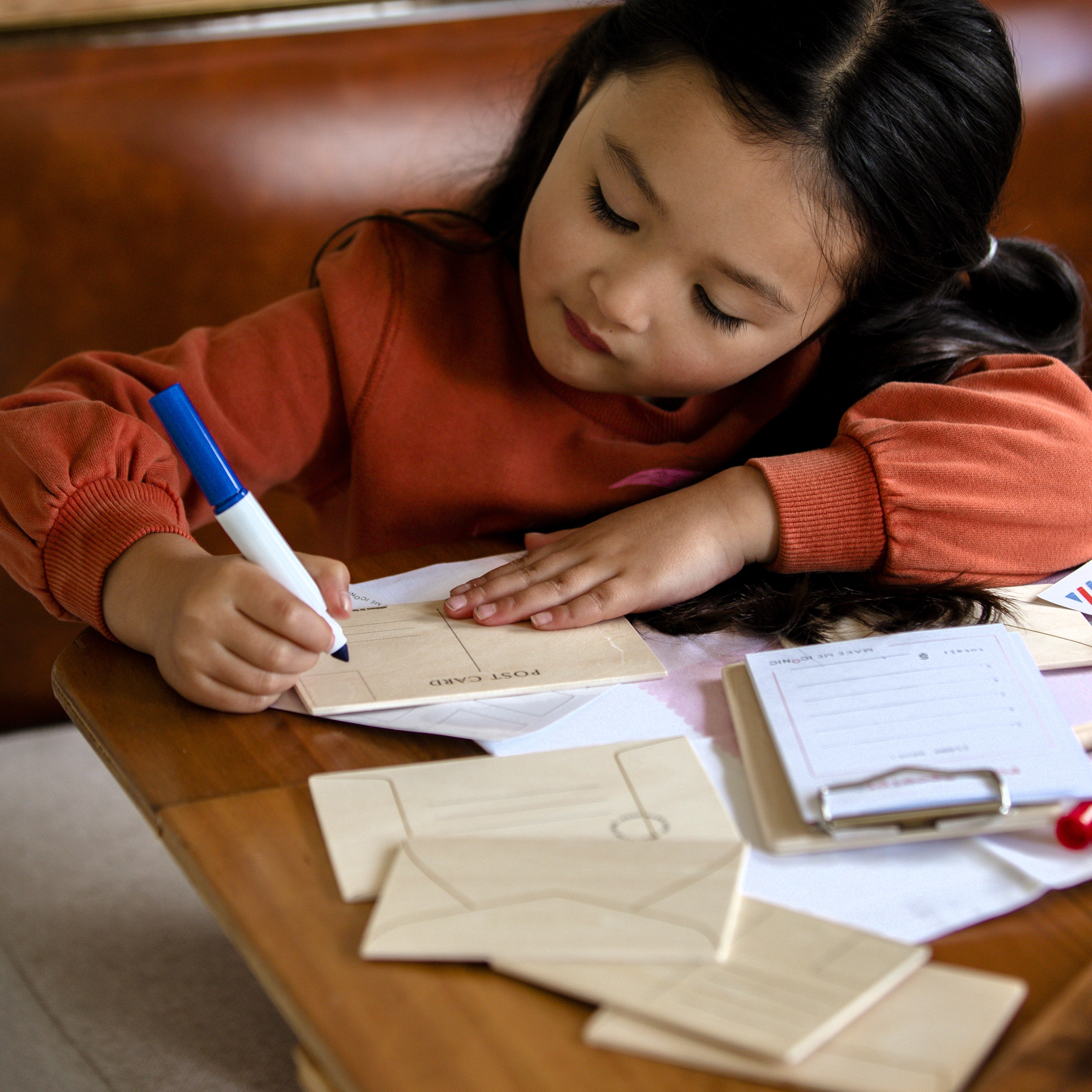 DIY Post Box Letters Craft Kit with colourful paper letters, stamps, and envelopes designed to pair with wooden toy Iconic Post Box for imaginative play.