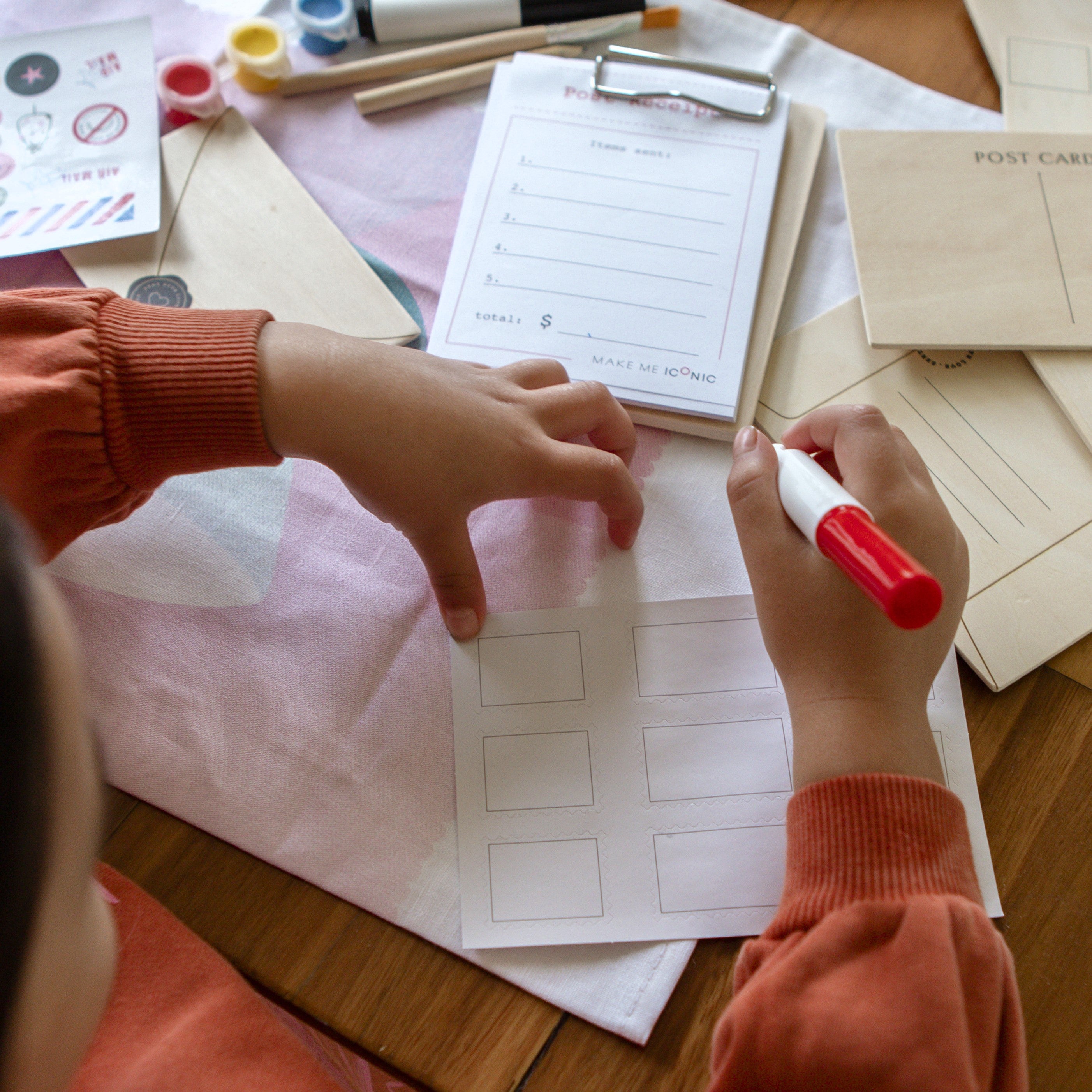 DIY Post Box Letters Craft Kit with colourful paper letters, stamps, and envelopes designed to pair with wooden toy Iconic Post Box for imaginative play.