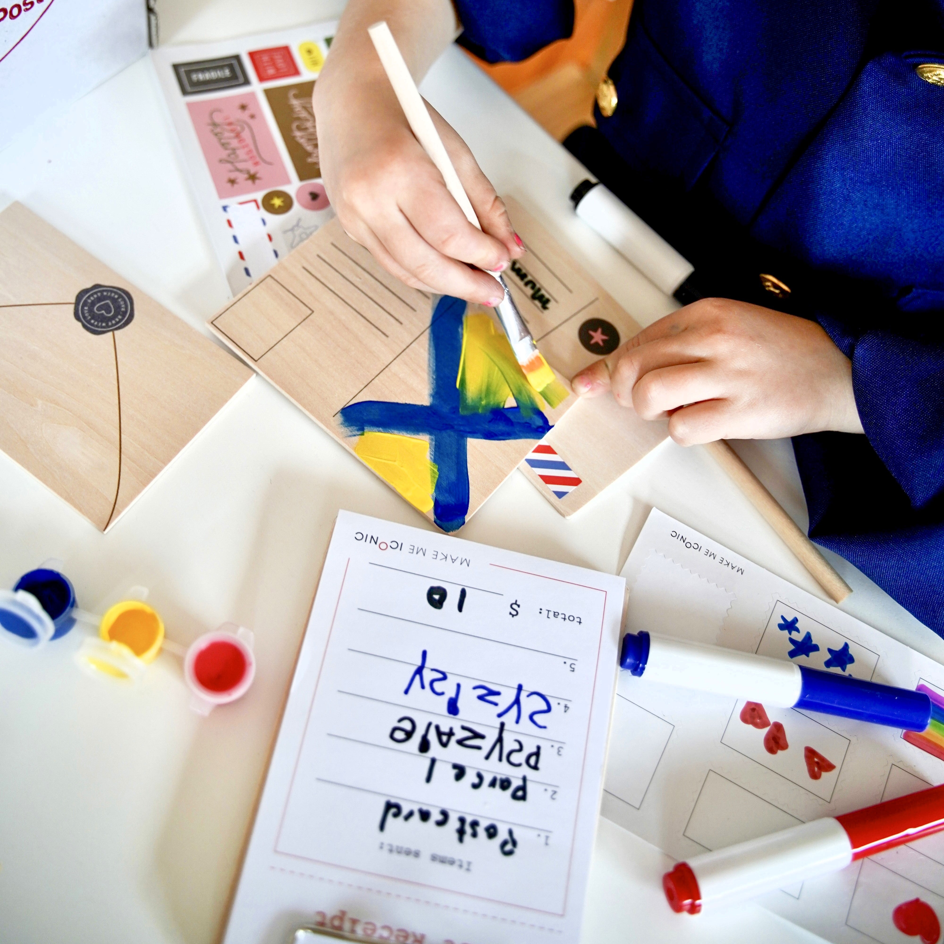 DIY Post Box Letters Craft Kit with colourful paper letters, stamps, and envelopes designed to pair with wooden toy Iconic Post Box for imaginative play.