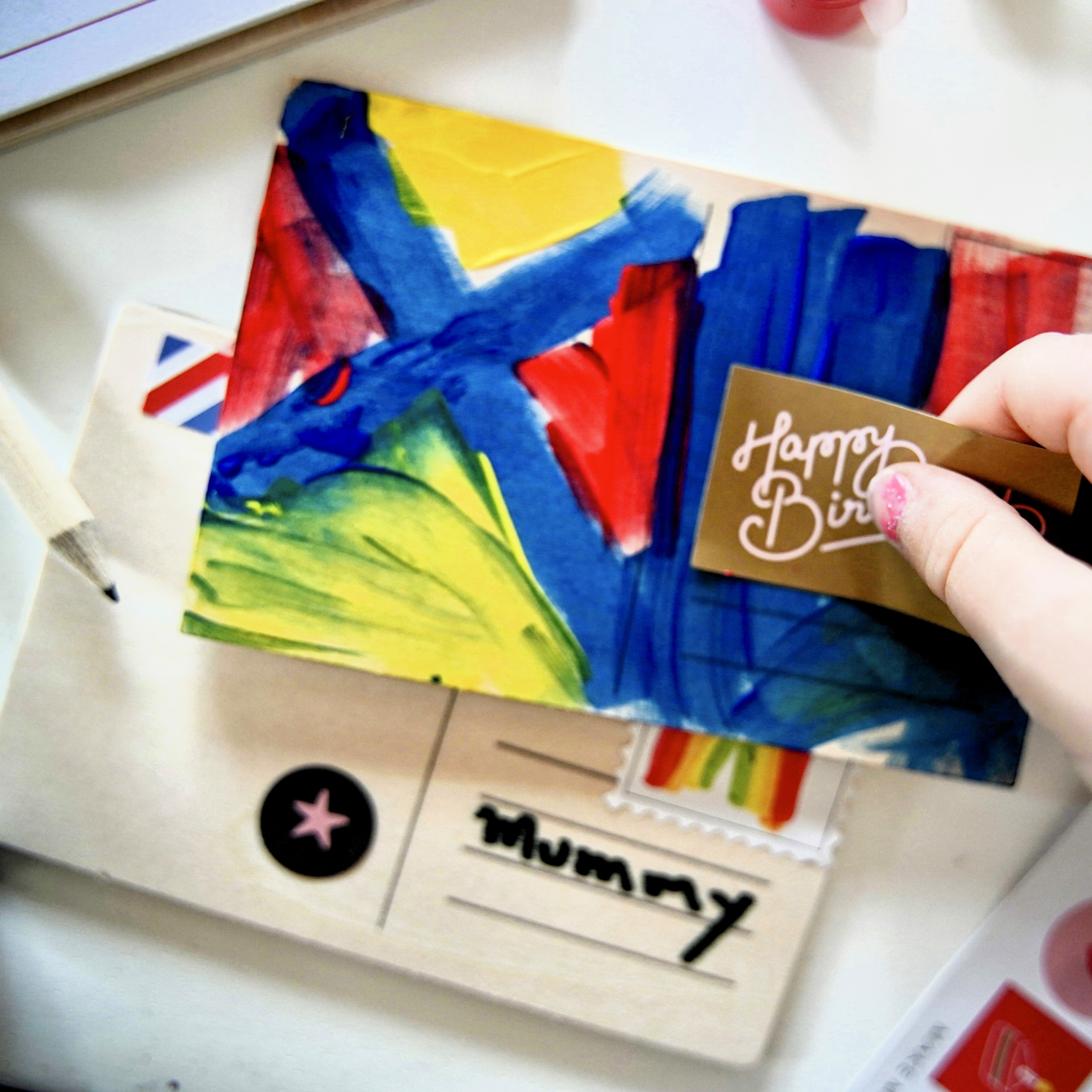 DIY Post Box Letters Craft Kit with colourful paper letters, stamps, and envelopes designed to pair with wooden toy Iconic Post Box for imaginative play.