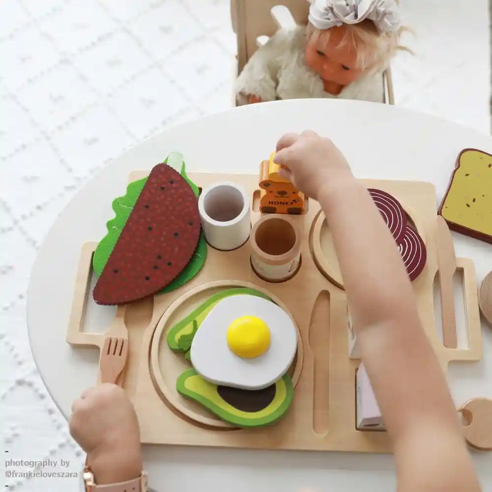Children playing with wooden toys and pretend food play set encouraging imaginative play and less screen time.