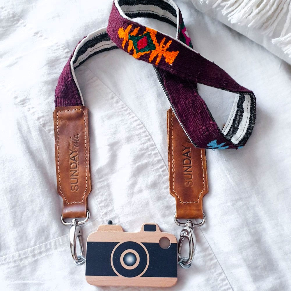 Make Me Iconic wooden toy camera customised with vintage camera strap using screw eyelets – simple DIY craft for wooden toy personalisation.