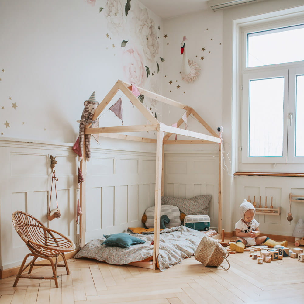 Beautiful kids playroom setup with wooden toys, neutral decor, and organised shelves designed to inspire creative and imaginative play.