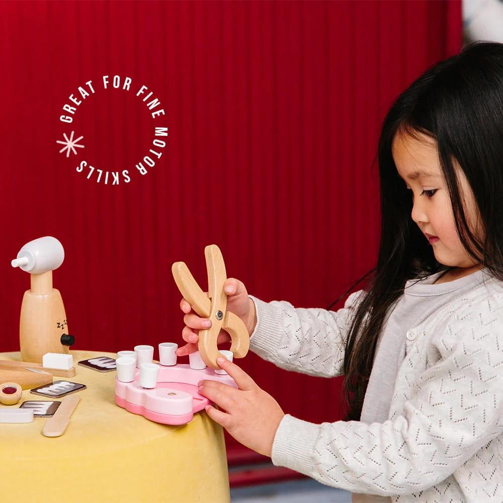 Children playing with wooden toys that encourage imaginative play, creativity, and early childhood development.