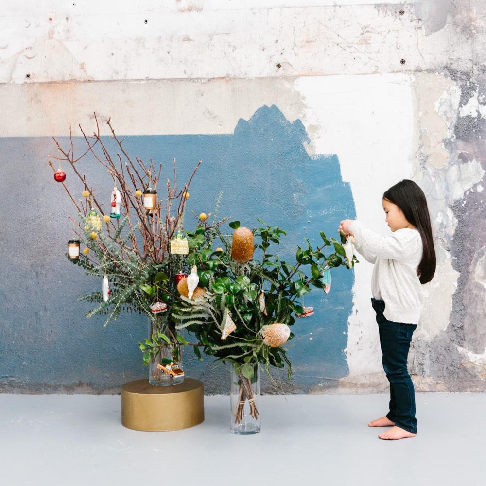 Make Me Iconic Christmas glass ornament set, 5-piece Australian-themed decorations featuring Fairy Bread, Lamington, Ute with tree, Surfboard, and Cockatoo, crafted in glass with paint and glitter details, great for gifts and Aussie souvenirs.