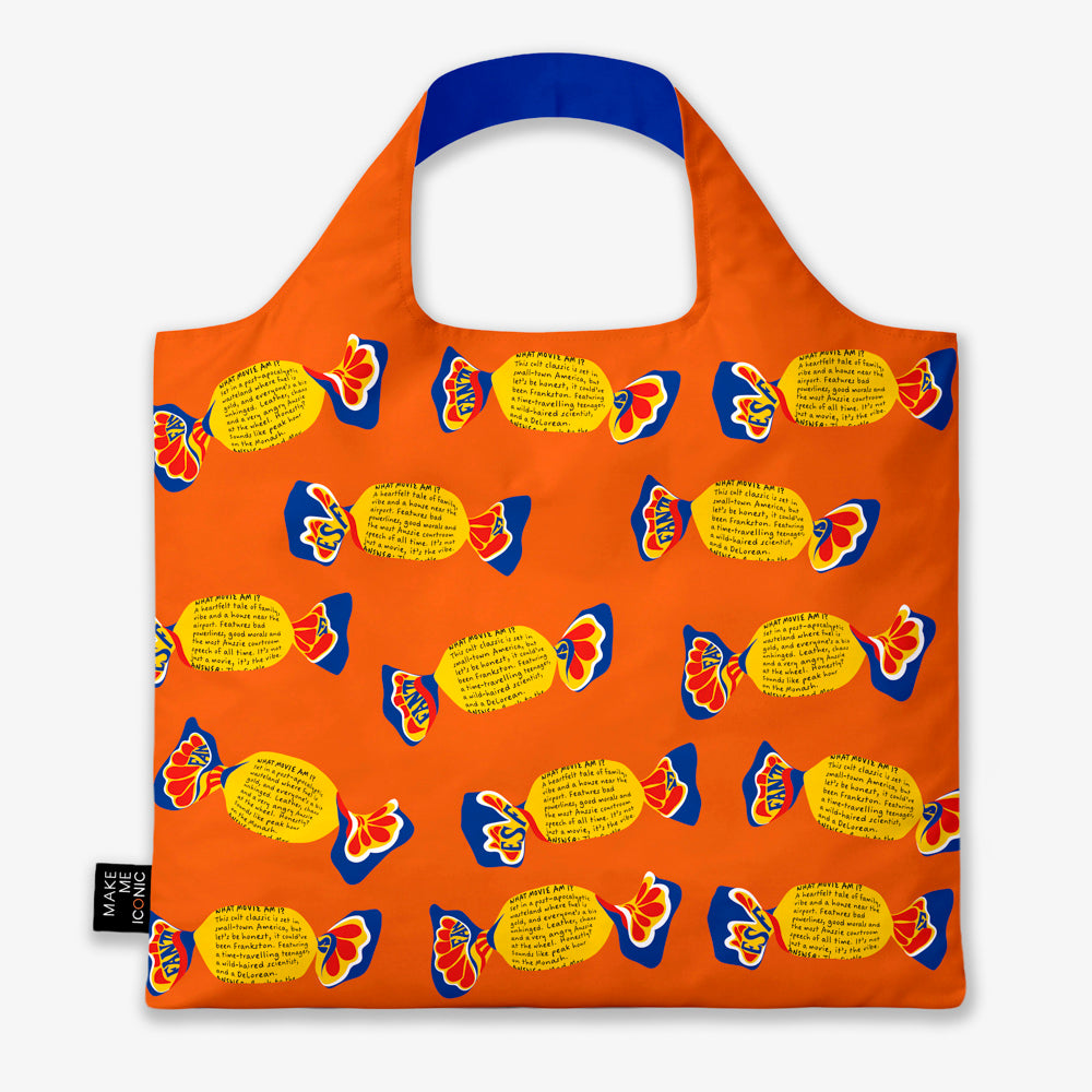 A Make Me Iconic reusable foldable shopping bag featuring a nostalgic Fantale lolly design on a vibrant orange background. Made from 100% recycled fabric, this lightweight bag folds into its own matching pouch, making it perfect for shopping, travel, or everyday use while celebrating one of Australia's most iconic treats.