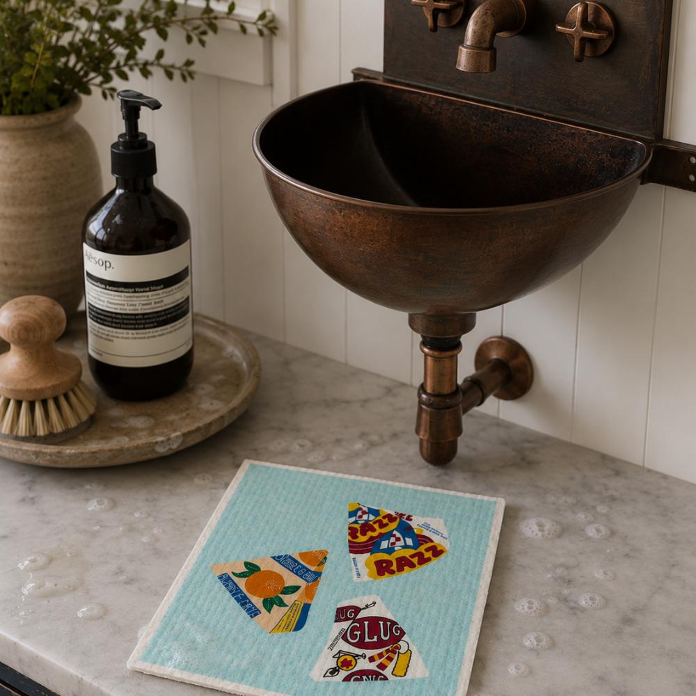 A Make Me Iconic reusable Swedish dishcloth featuring illustrations of three iconic Australian frozen treats: Bubble O' Bill, Golden Gaytime and Sunnyboy. The eco-friendly sponge has a nostalgic Aussie ice cream design in bright colours, making it a fun and practical kitchen cleaning cloth for everyday use.