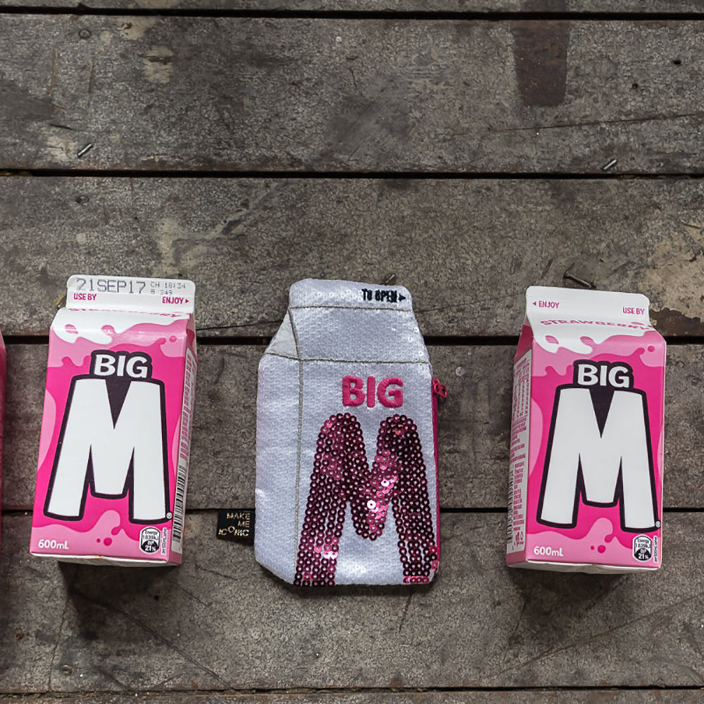 Big M Pocket Purse inspired by the iconic Aussie strawberry milk drink. Featuring shimmering sequins, it's perfect for coins, keys and little treasures.