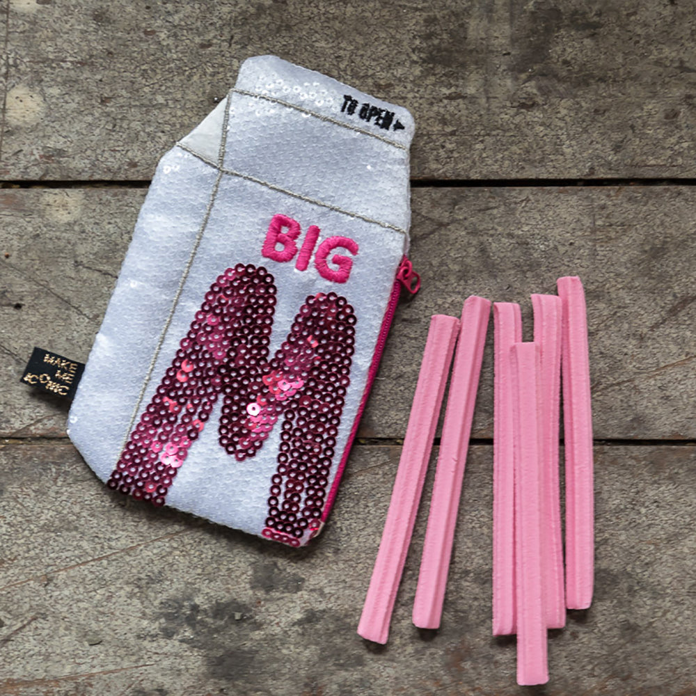 Big M Pocket Purse inspired by the iconic Aussie strawberry milk drink. Featuring shimmering sequins, it's perfect for coins, keys and little treasures.