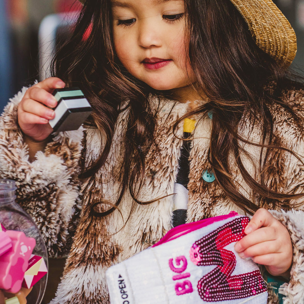 Big M Pocket Purse inspired by the iconic Aussie strawberry milk drink. Featuring shimmering sequins, it's perfect for coins, keys and little treasures.