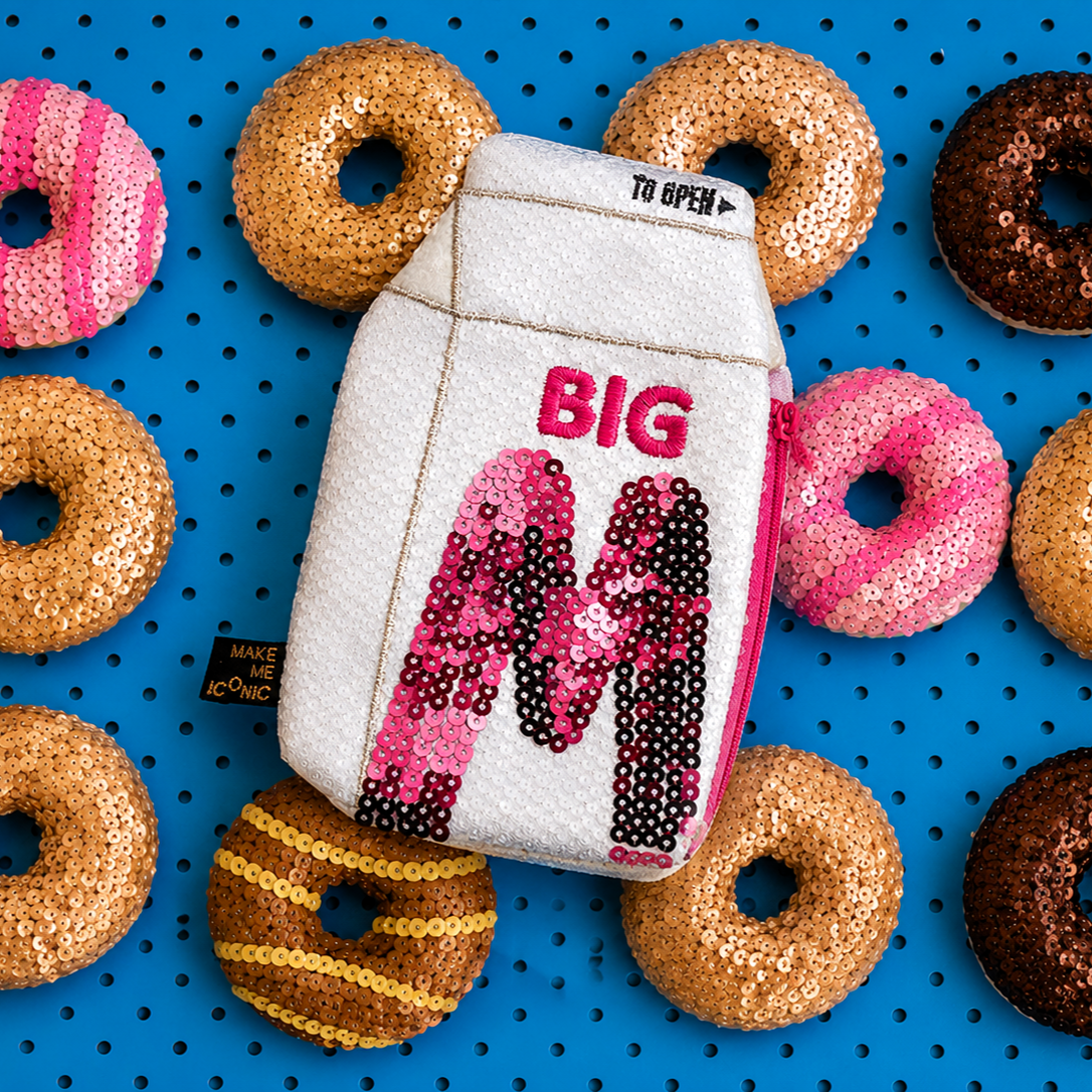 Big M Pocket Purse inspired by the iconic Aussie strawberry milk drink. Featuring shimmering sequins, it's perfect for coins, keys and little treasures.