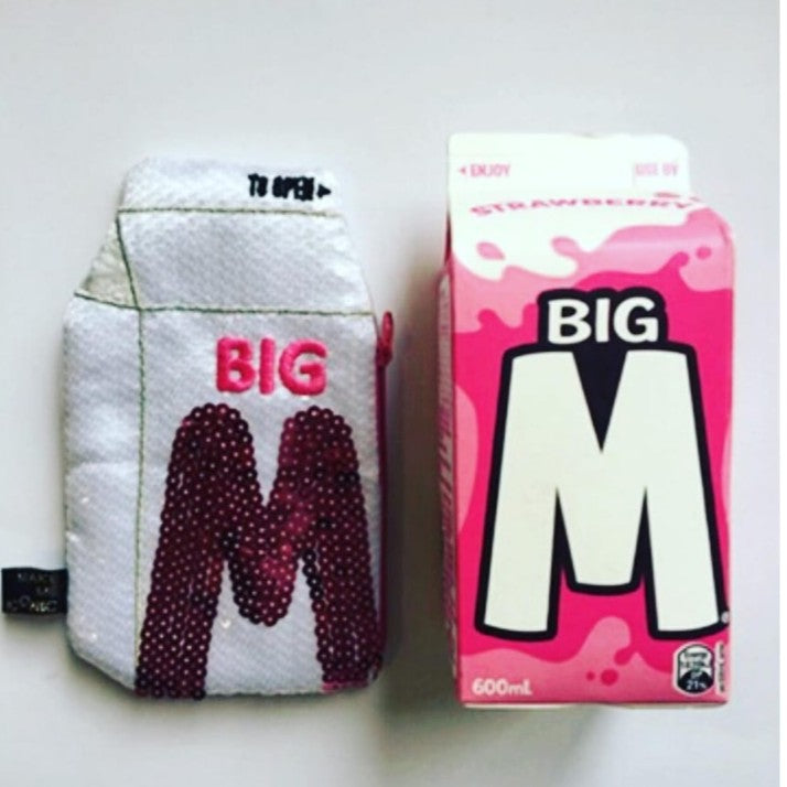 Big M Pocket Purse inspired by the iconic Aussie strawberry milk drink. Featuring shimmering sequins, it's perfect for coins, keys and little treasures.