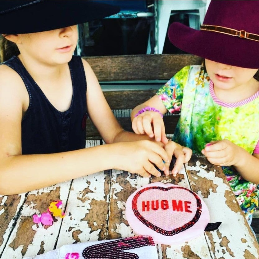 Big M Pocket Purse inspired by the iconic Aussie strawberry milk drink. Featuring shimmering sequins, it's perfect for coins, keys and little treasures.