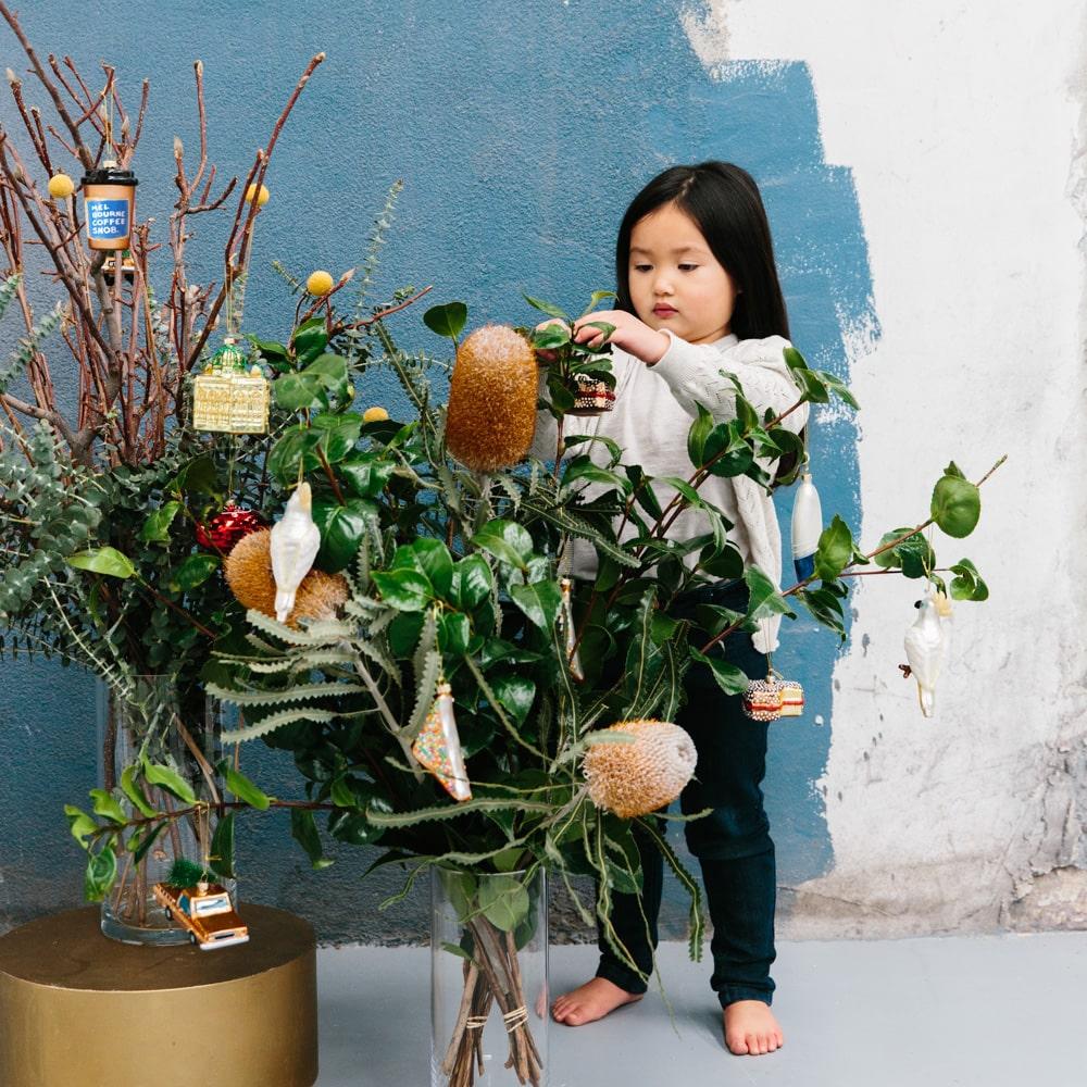 Melbourne Christmas glass ornaments in a gift box featuring Australian holiday decorations such as the Skipping Girl, W-Class Tram, Flinders Street Station, and Coffee Snob designs.
