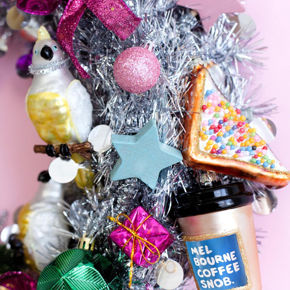 Make Me Iconic Christmas glass ornament set, 5-piece Australian-themed decorations featuring Fairy Bread, Lamington, Ute with tree, Surfboard, and Cockatoo, crafted in glass with paint and glitter details, great for gifts and Aussie souvenirs.