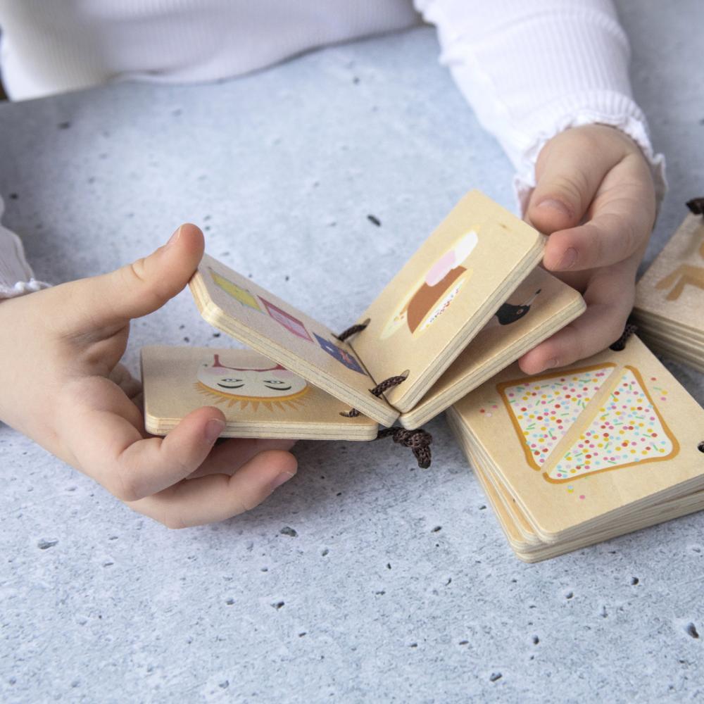 Make Me Iconic Iconic Australian Favourites mini wooden book for toddlers, featuring Aussie icons including fairy bread, Ugg boots, surfboards and beach days for early learning, word recognition and screen-free play.