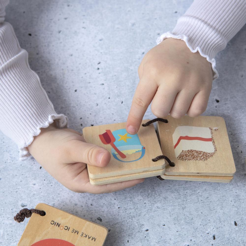 Make Me Iconic Iconic Australian Favourites mini wooden book for toddlers, featuring Aussie icons including fairy bread, Ugg boots, surfboards and beach days for early learning, word recognition and screen-free play.