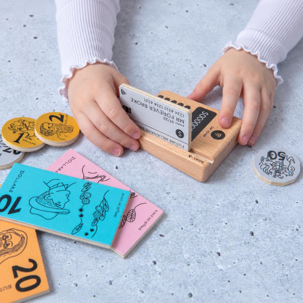 Make Me Iconic Iconic Australian Money & Point of Sale Machine wooden toy set for kids, with POS machine, credit card, Aussie banknotes and coins for imaginative shop role play and early maths learning.